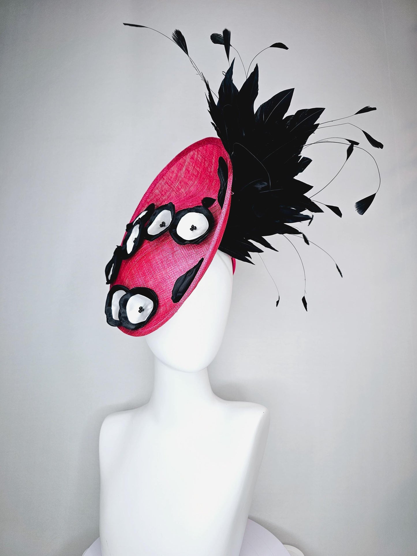 kentucky derby hat fascinator raspberry pink sinamay saucer with black and white satin flowers and black branch feathers