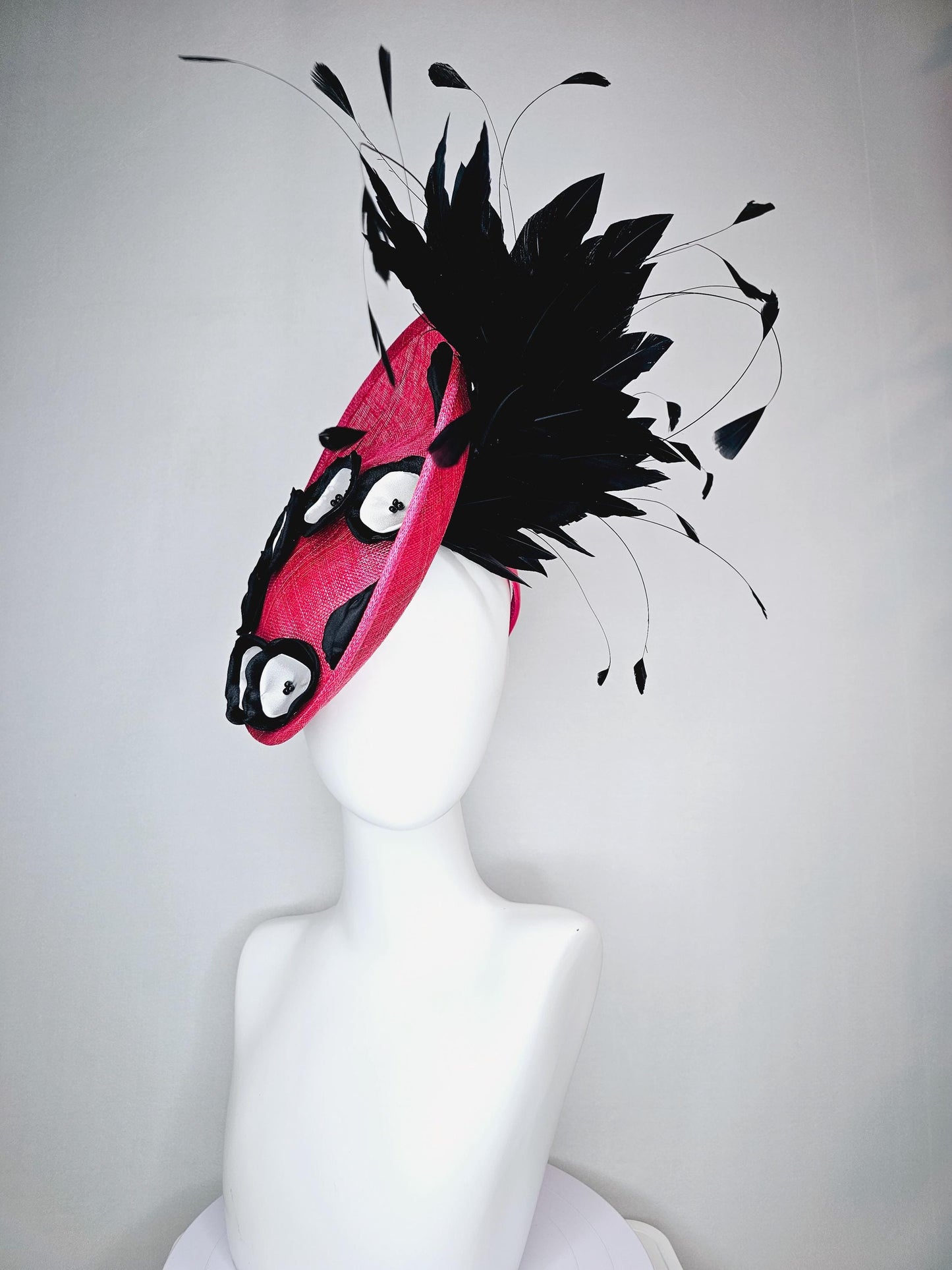 kentucky derby hat fascinator raspberry pink sinamay saucer with black and white satin flowers and black branch feathers