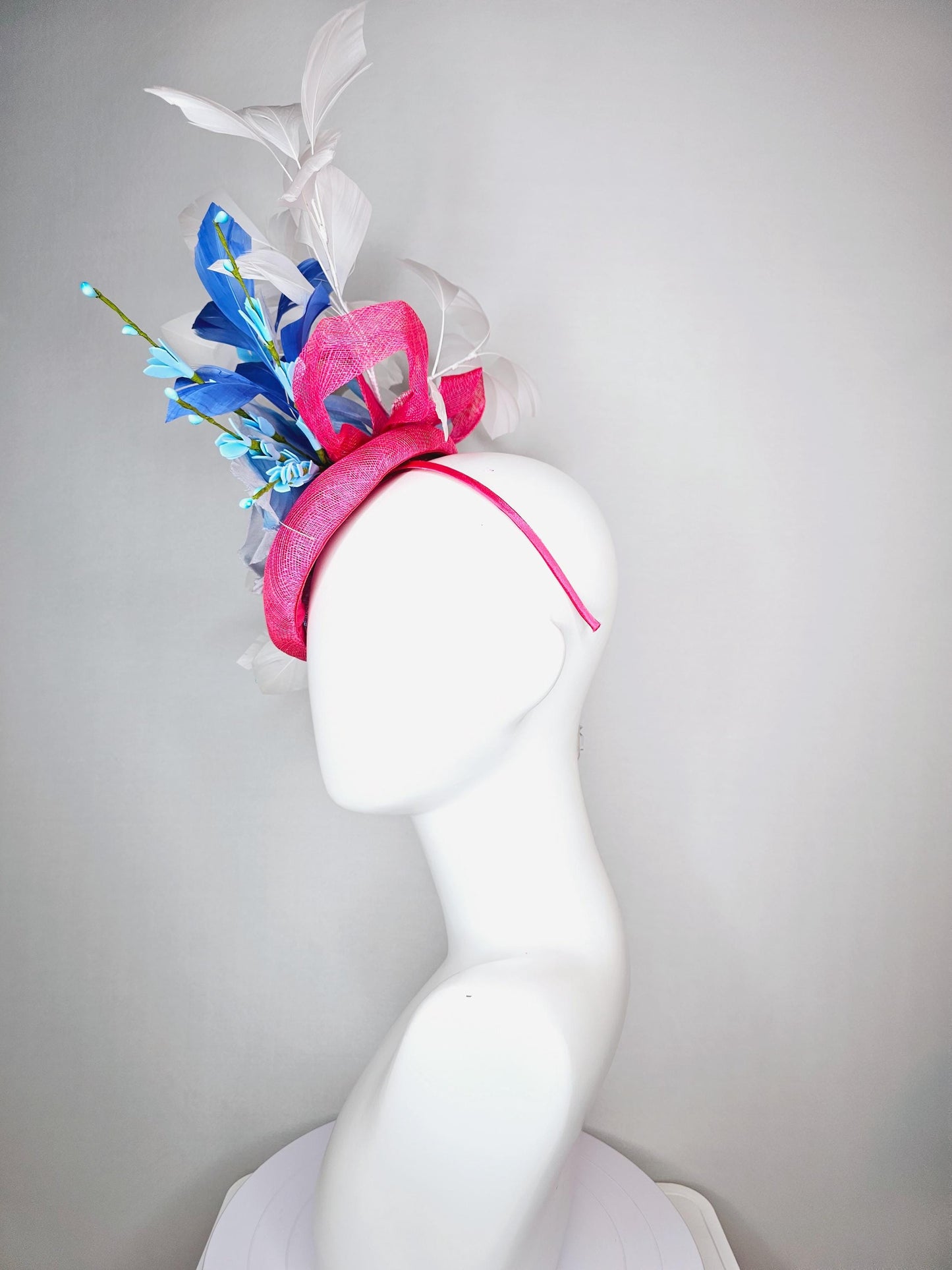 kentucky derby hat fascinator raspberry pink sinamay with sinamay bows and ombre blue organza rose flower and white and royal blue feathers