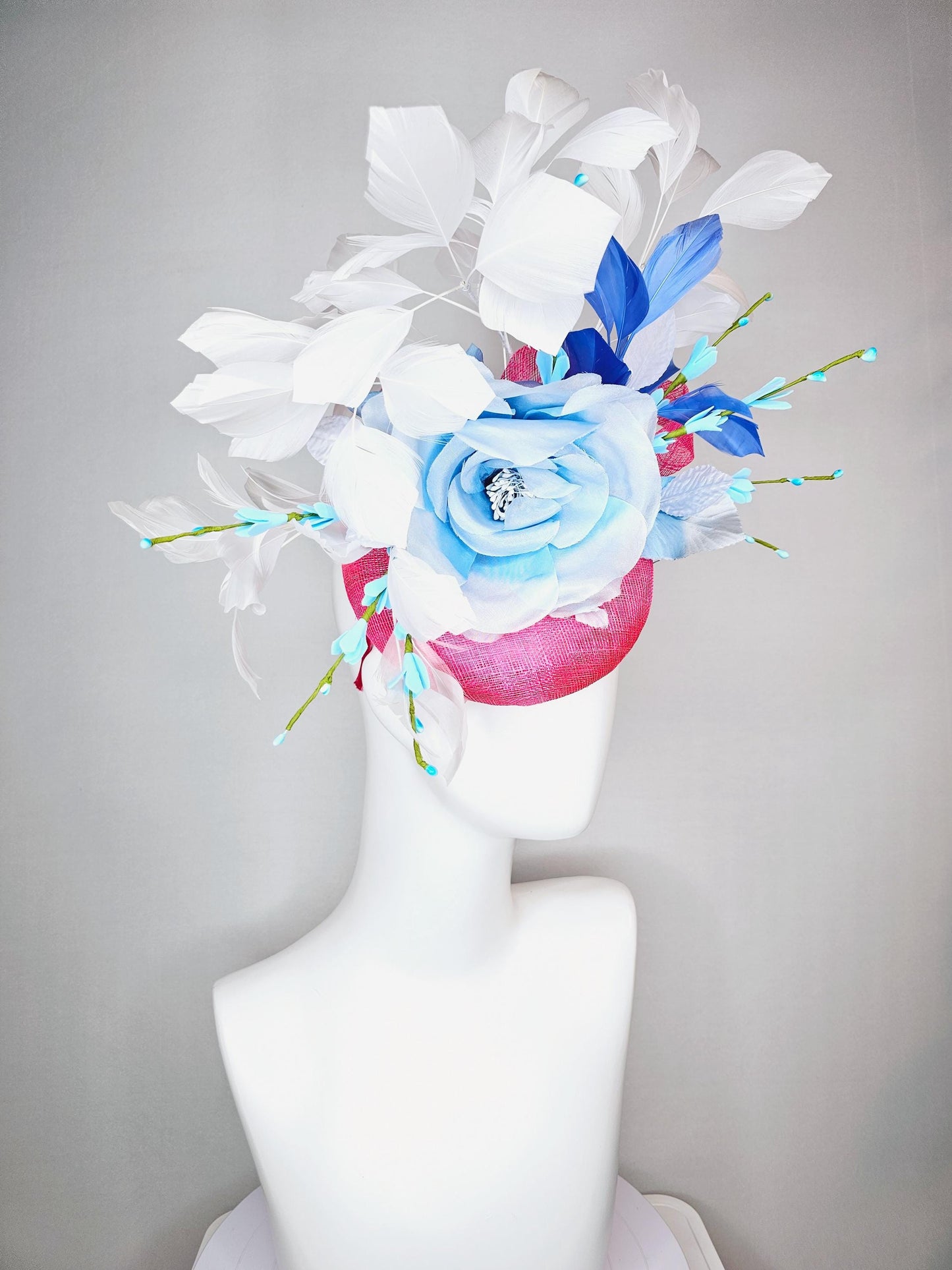 kentucky derby hat fascinator raspberry pink sinamay with sinamay bows and ombre blue organza rose flower and white and royal blue feathers