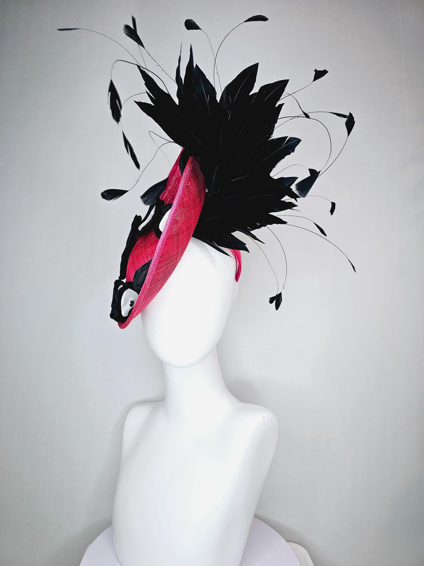 kentucky derby hat fascinator raspberry pink sinamay saucer with black and white satin flowers and black branch feathers