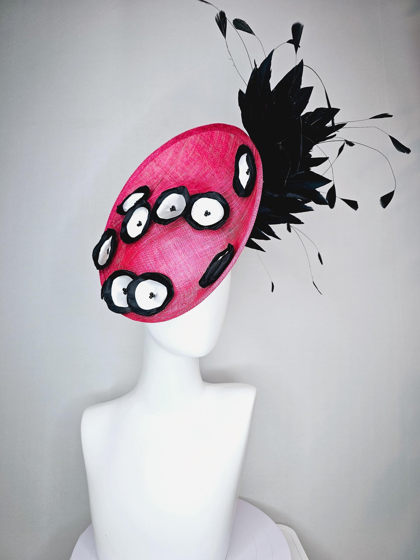 kentucky derby hat fascinator raspberry pink sinamay saucer with black and white satin flowers and black branch feathers