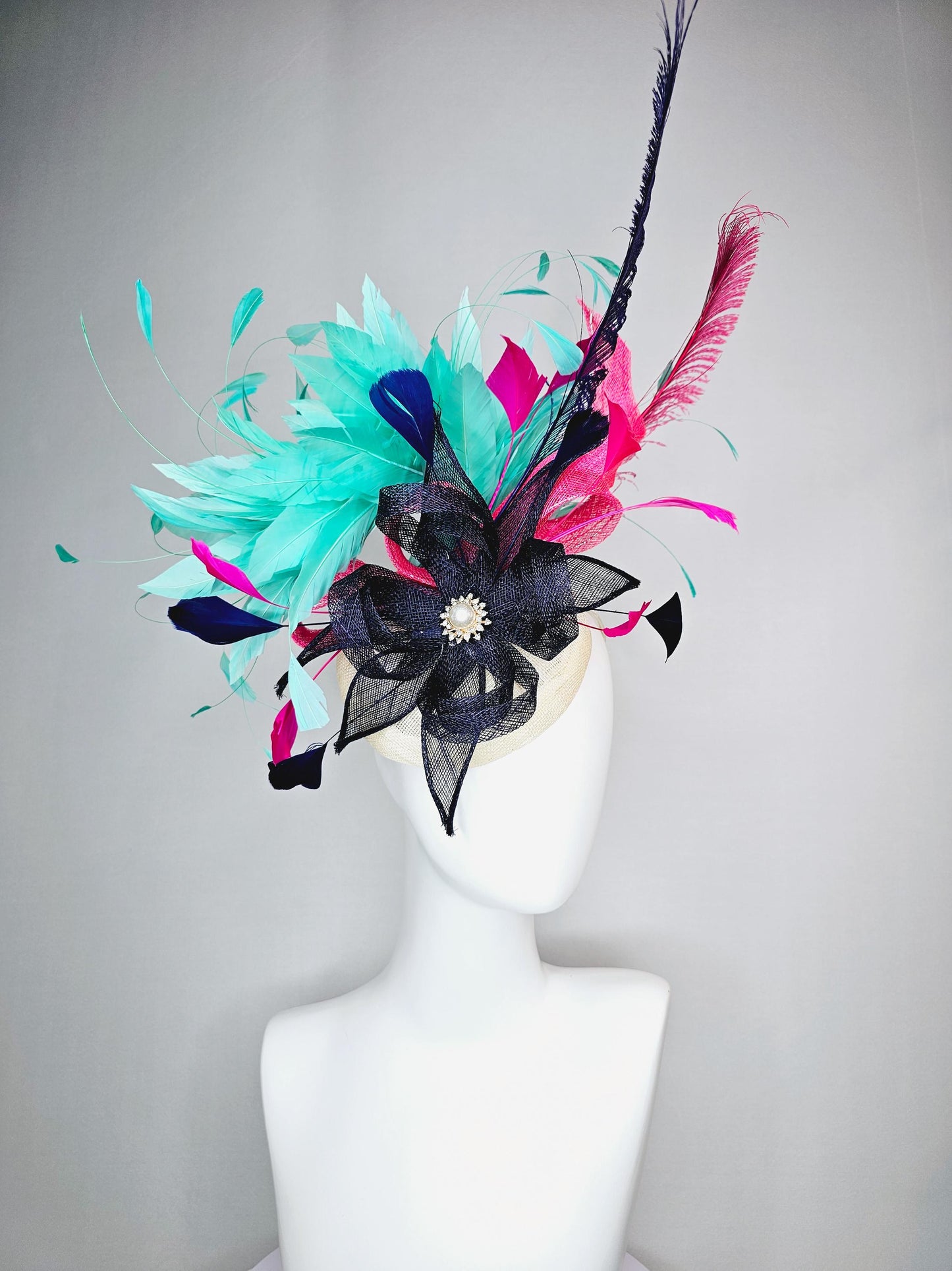 kentucky derby hat fascinator ivory white sinamay with navy blue raspberry pink sinamay flower and aqua green branching feathers