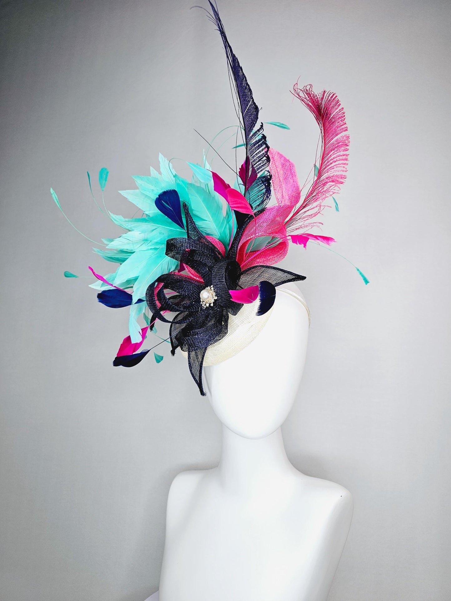 kentucky derby hat fascinator ivory white sinamay with navy blue raspberry pink sinamay flower and aqua green branching feathers