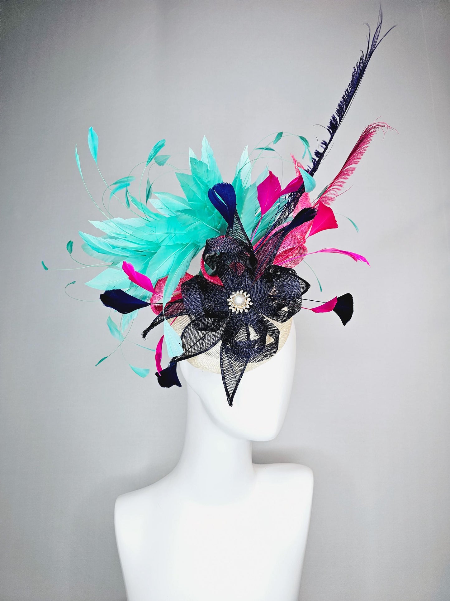 kentucky derby hat fascinator ivory white sinamay with navy blue raspberry pink sinamay flower and aqua green branching feathers
