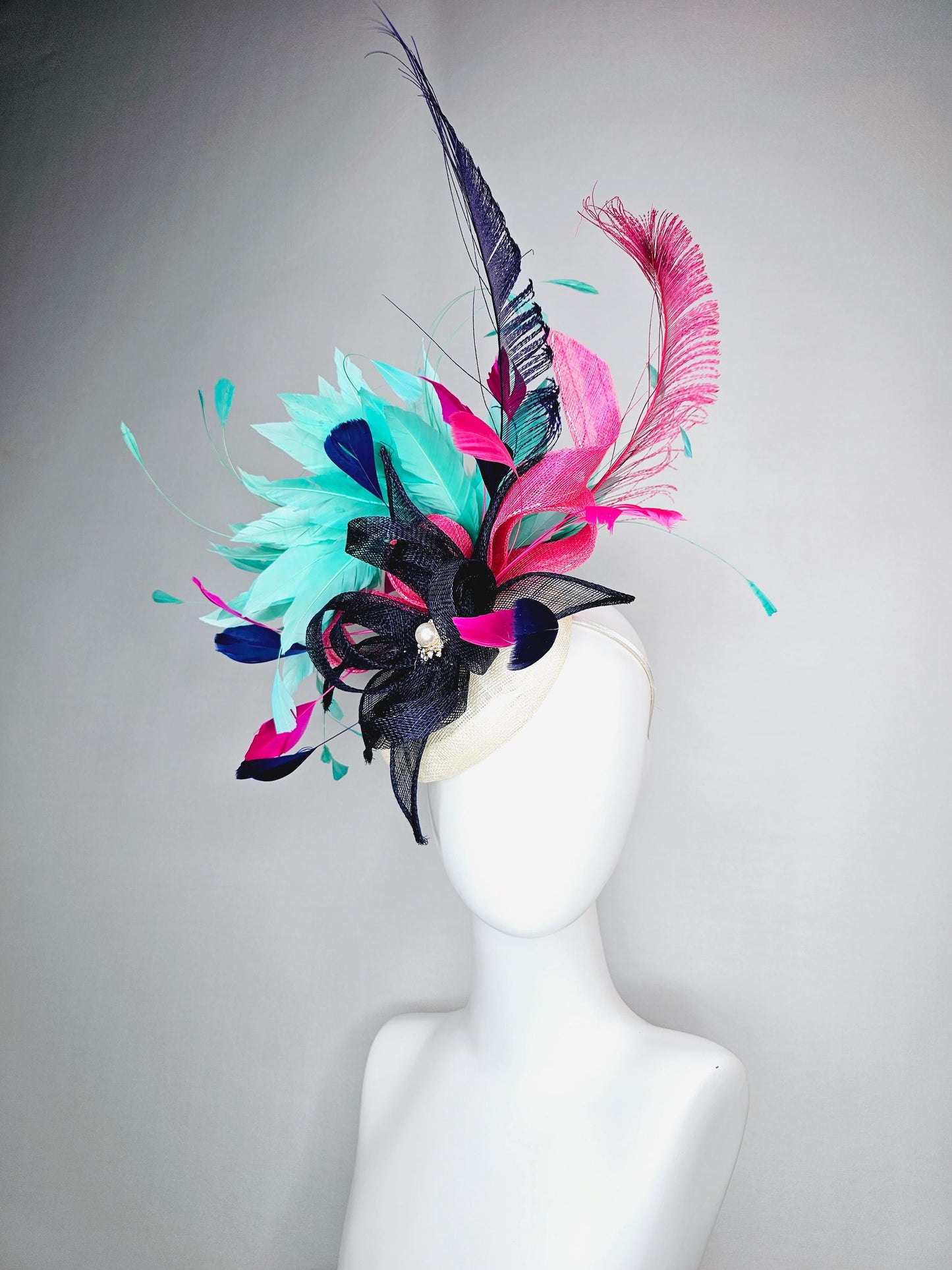 kentucky derby hat fascinator ivory white sinamay with navy blue raspberry pink sinamay flower and aqua green branching feathers