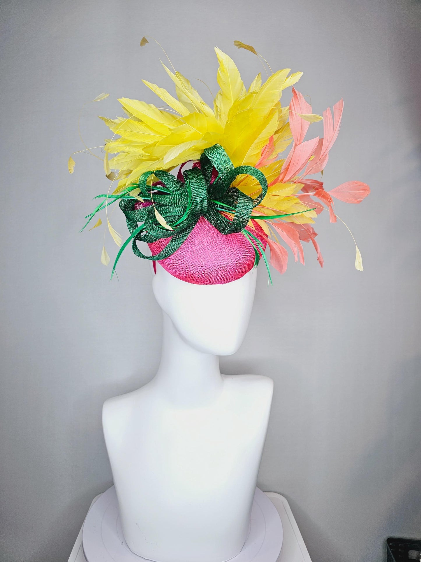 kentucky derby hat fascinator hot pink sinamay with dark green sinamay curls and yellow and peach coral branching feathers