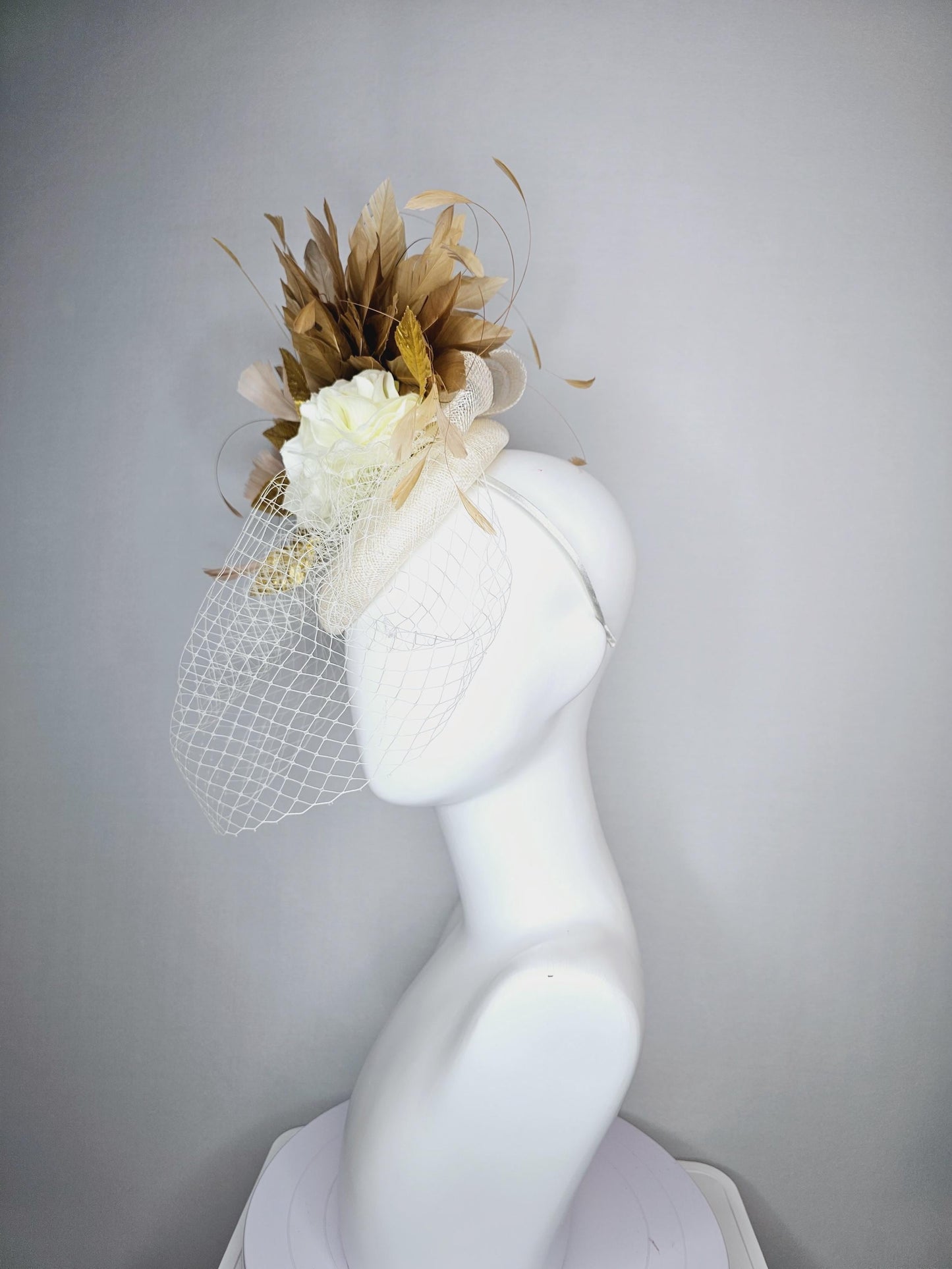 kentucky derby hat fascinator white sinamay with white netting off white silk roses gold lame metallic eaves gold beige branching feathers