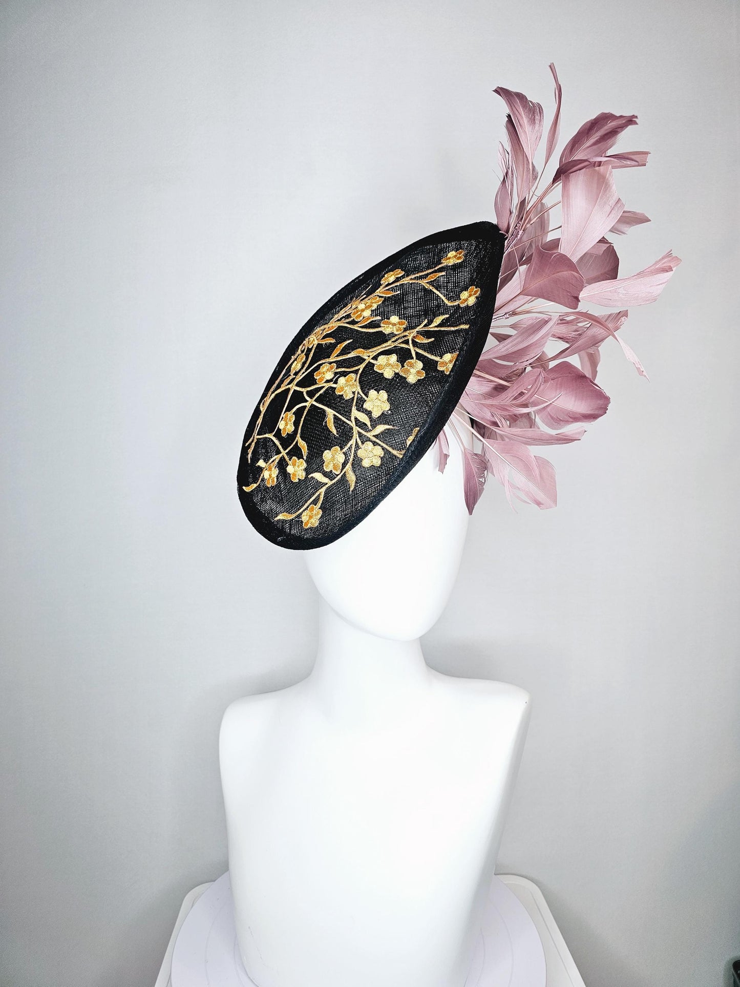 kentucky derby hat fascinator black sinamay saucer with embroidered yellow gold flowers and dusty rose pink branching feathers