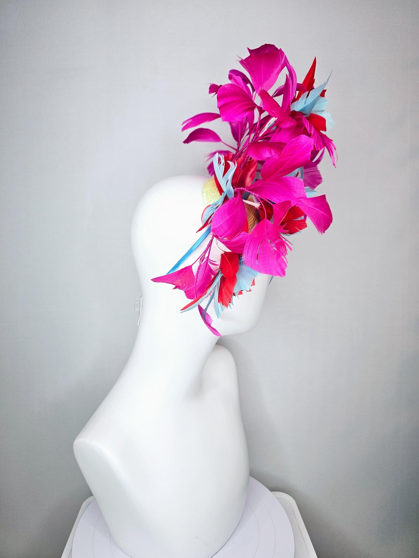 kentucky derby hat fascinator with large scarlet red and baby blue feather flowers and bright pink branching feathers