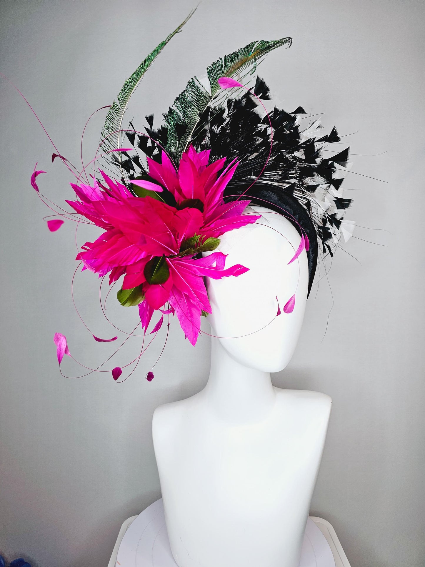 kentucky derby hat fascinator black satin headband with fuchsia pink feather flower green feathers and black and white branching feathers