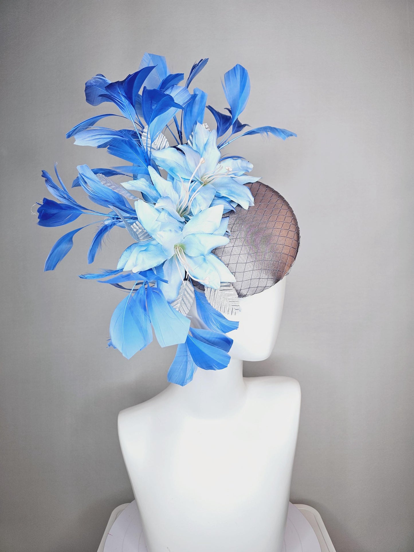 kentucky derby hat fascinator silver gray satin with netting light baby blue satin flowers silver leaves and royal blue branching feathers