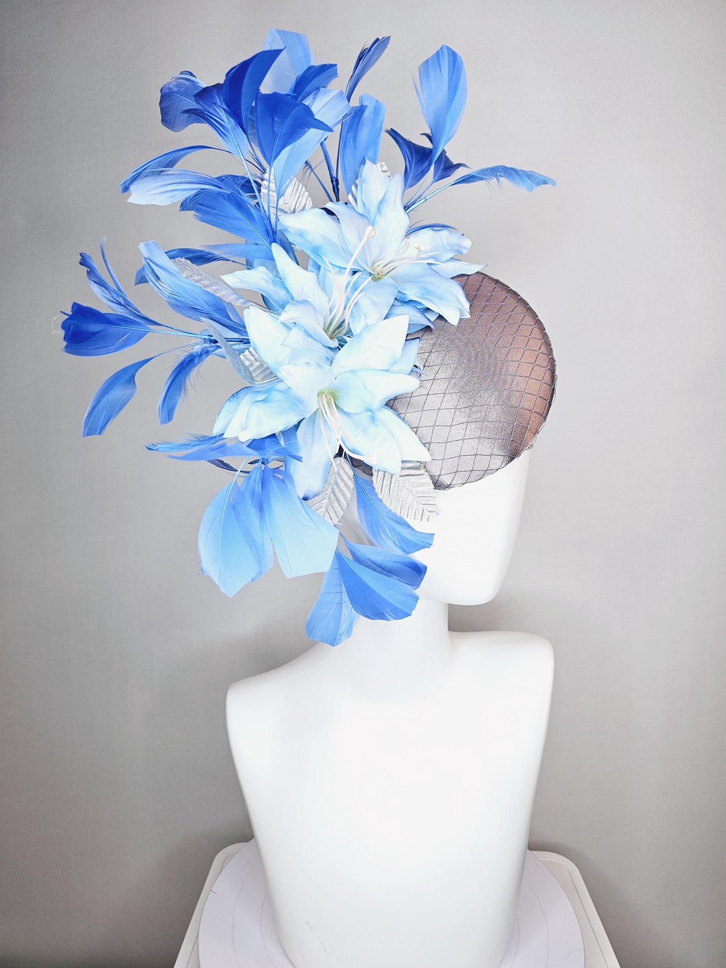 kentucky derby hat fascinator silver gray satin with netting light baby blue satin flowers silver leaves and royal blue branching feathers