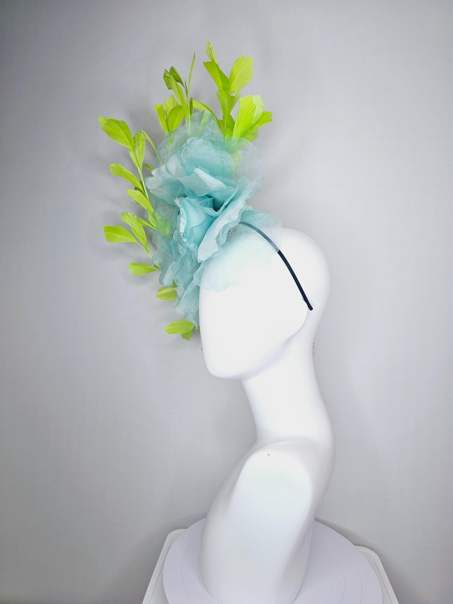 kentucky derby fascinator black headband with very large baby blue organza silk flower and lime green branching feathers