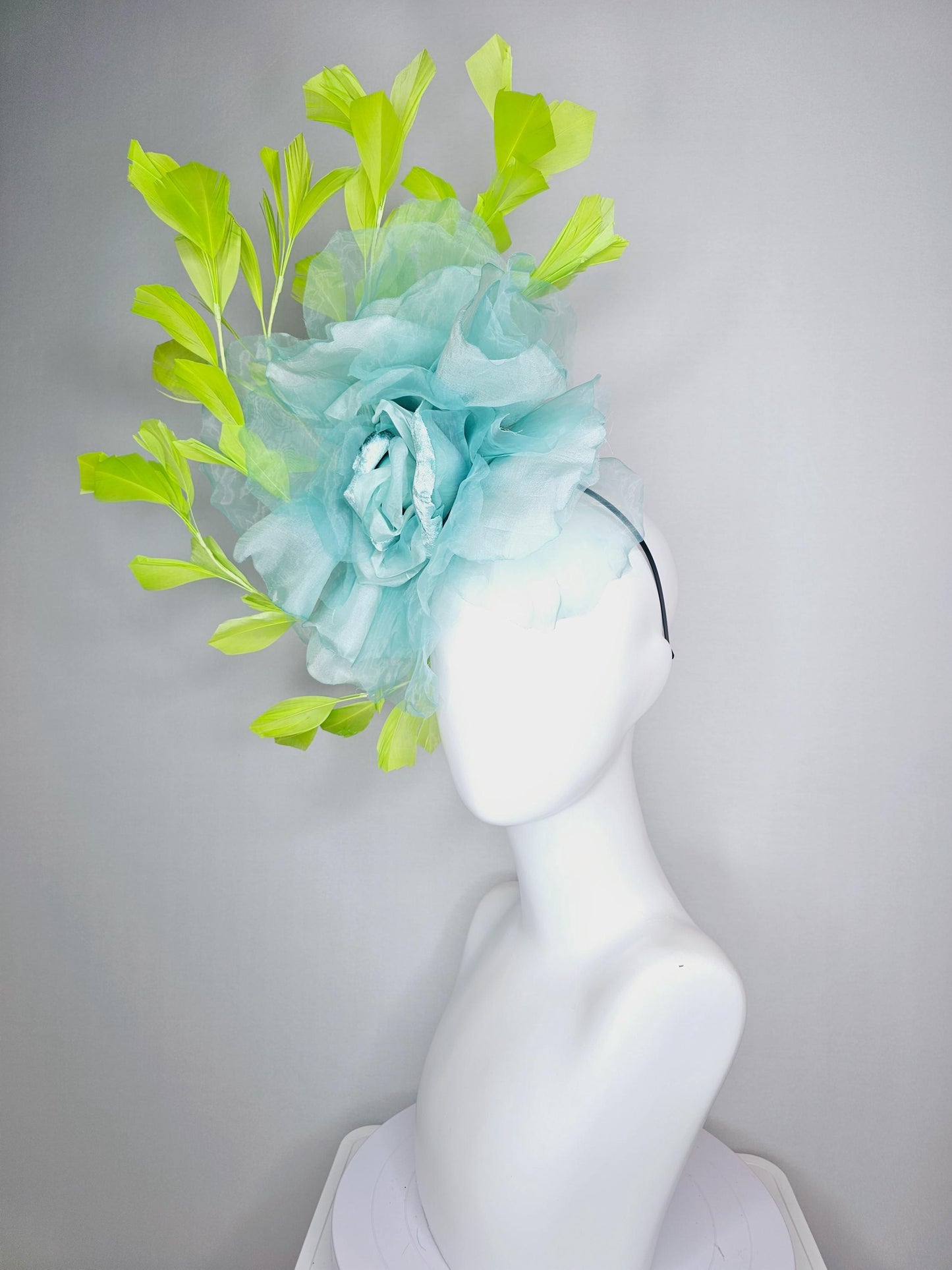 kentucky derby fascinator black headband with very large baby blue organza silk flower and lime green branching feathers