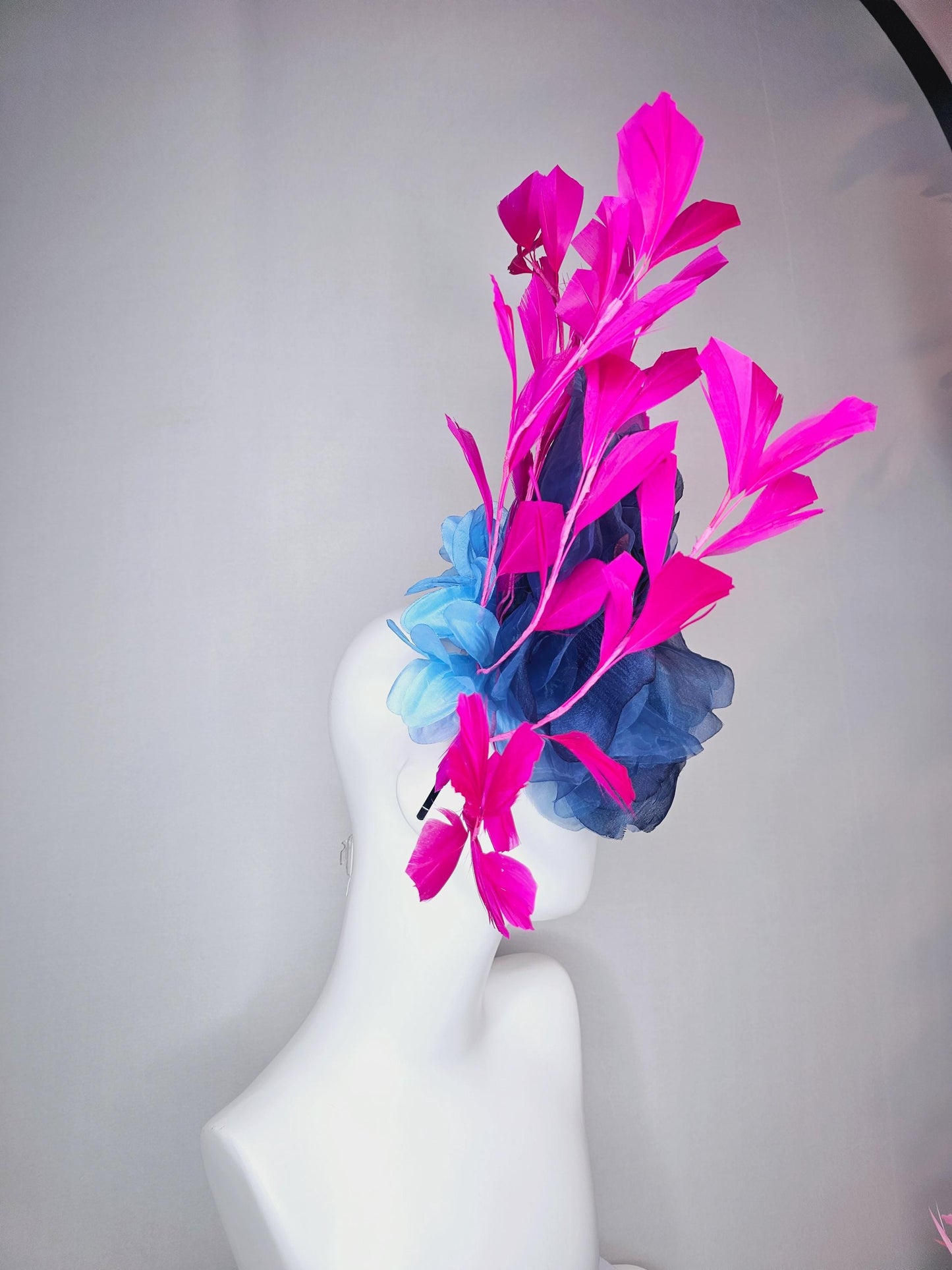 kentucky derby fascinator black headband with very large cobalt denim blue organza silk flower and bright fuchsia pink branching feathers