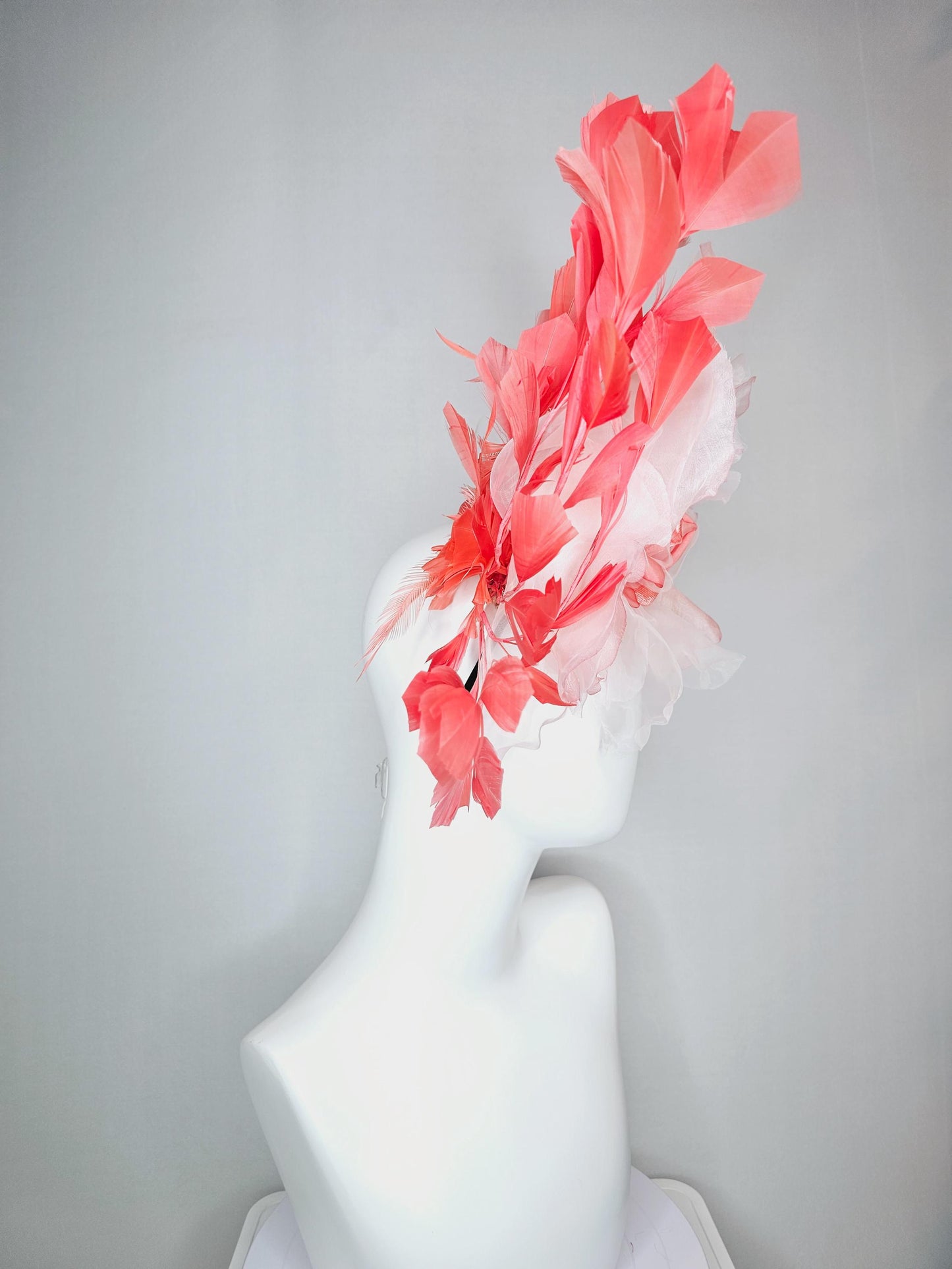 kentucky derby fascinator black headband with very large light pink organza silk flower and coral red branching feathers
