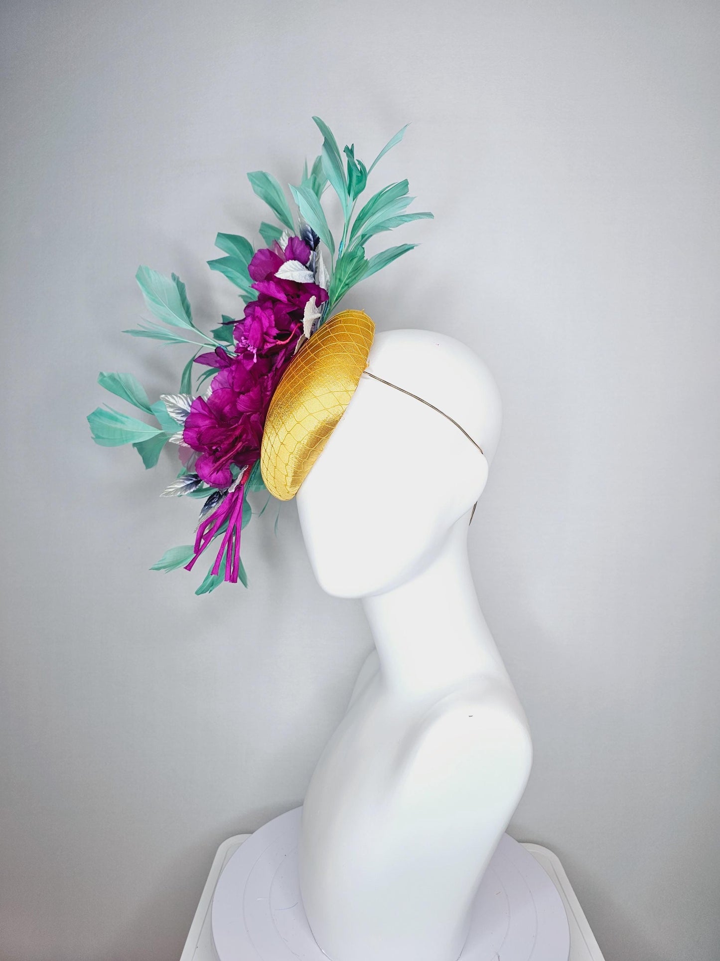 kentucky derby hat fascinator yellow gold satin with netting fuchsia pink organza satin flowers ombre blue leaves mint green feathers
