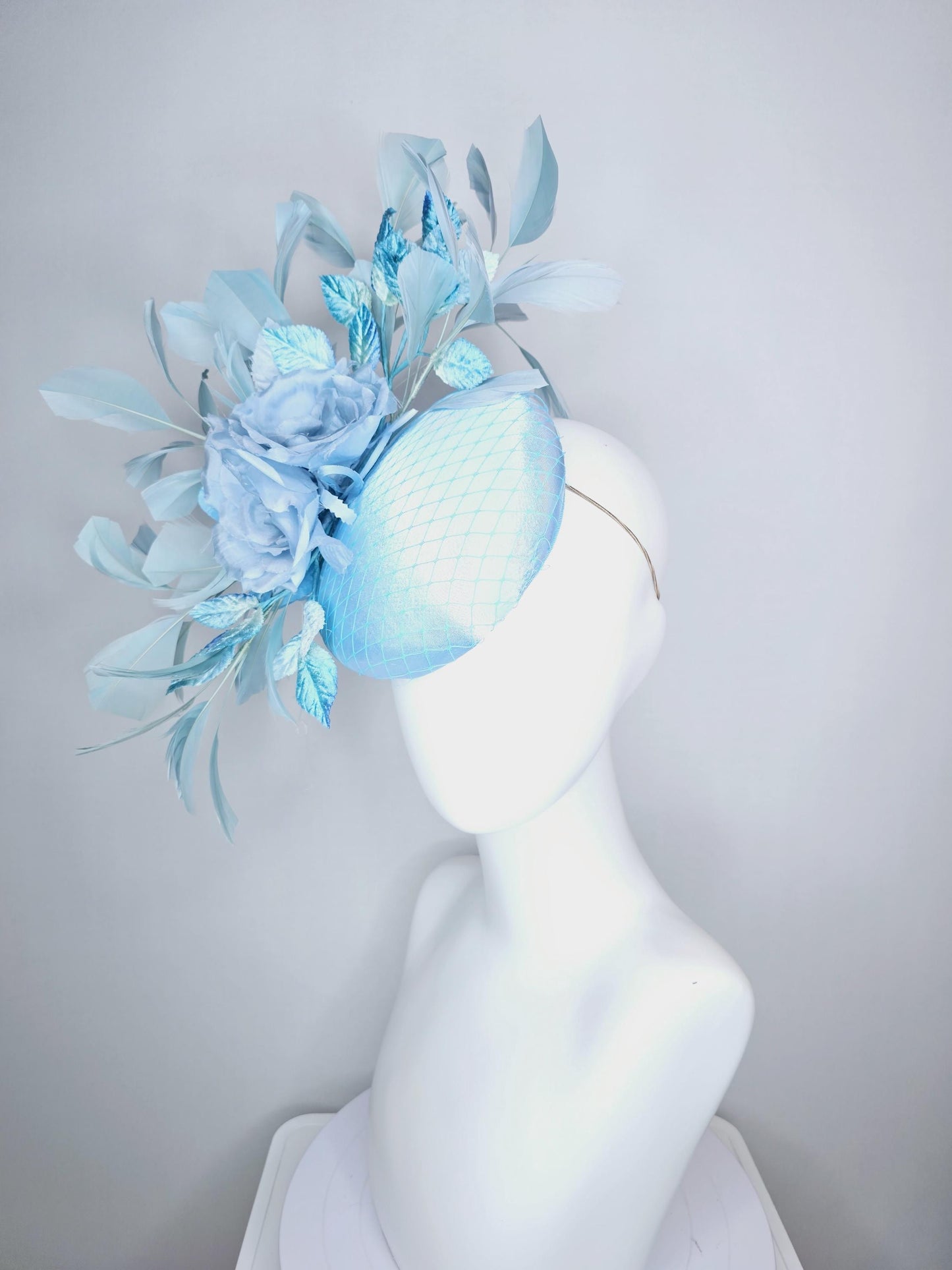 kentucky derby hat fascinator baby blue satin with netting light blue satin rose flowers blue ombre velvet leaves light teal blue feathers