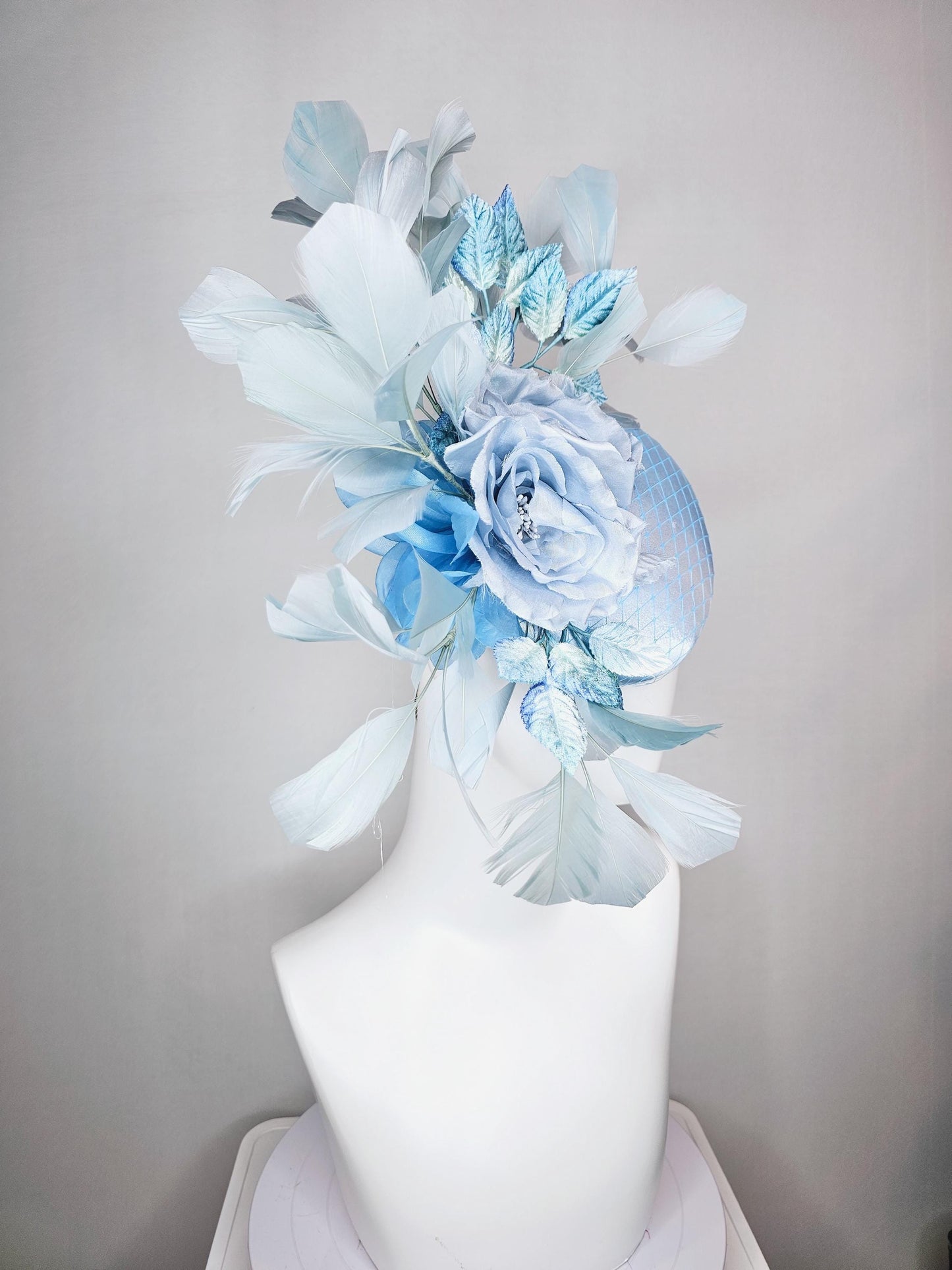 kentucky derby hat fascinator baby blue satin with netting light blue satin rose flowers blue ombre velvet leaves light teal blue feathers