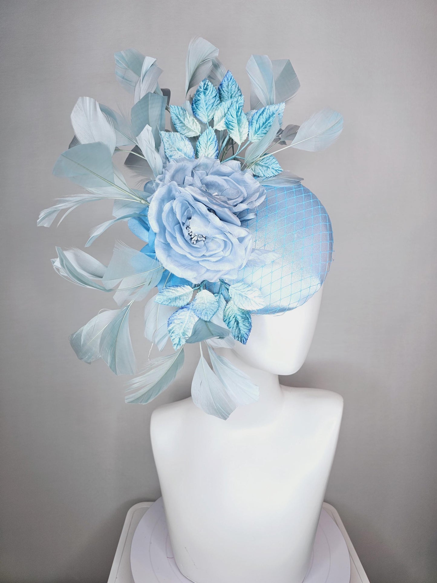 kentucky derby hat fascinator baby blue satin with netting light blue satin rose flowers blue ombre velvet leaves light teal blue feathers