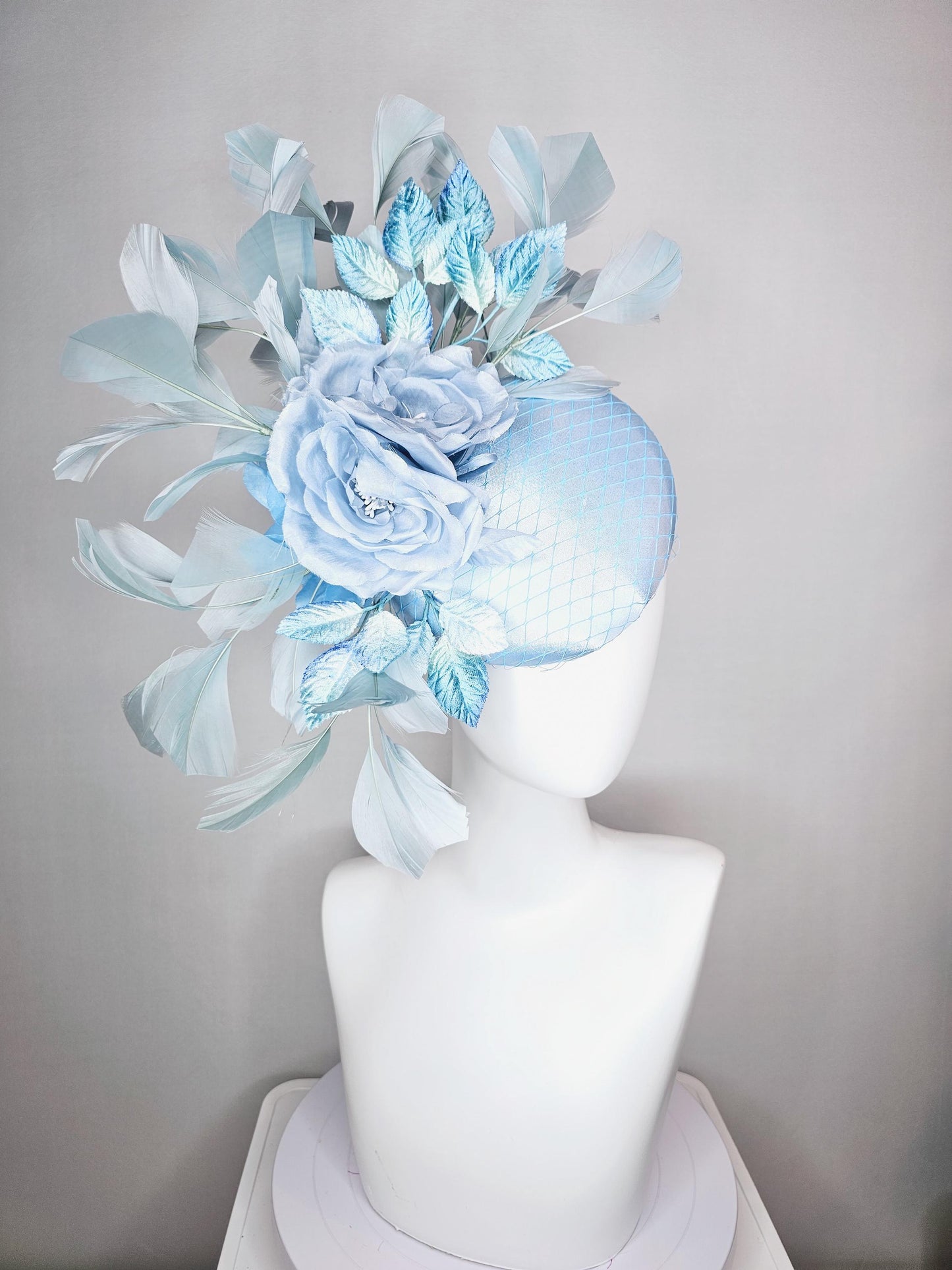 kentucky derby hat fascinator baby blue satin with netting light blue satin rose flowers blue ombre velvet leaves light teal blue feathers