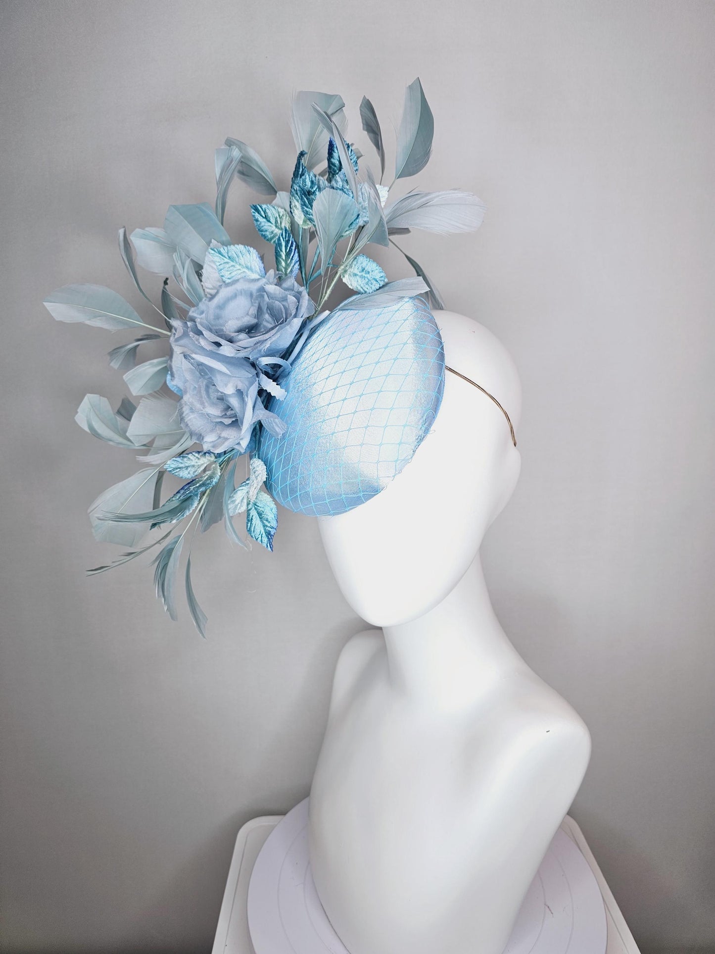 kentucky derby hat fascinator baby blue satin with netting light blue satin rose flowers blue ombre velvet leaves light teal blue feathers