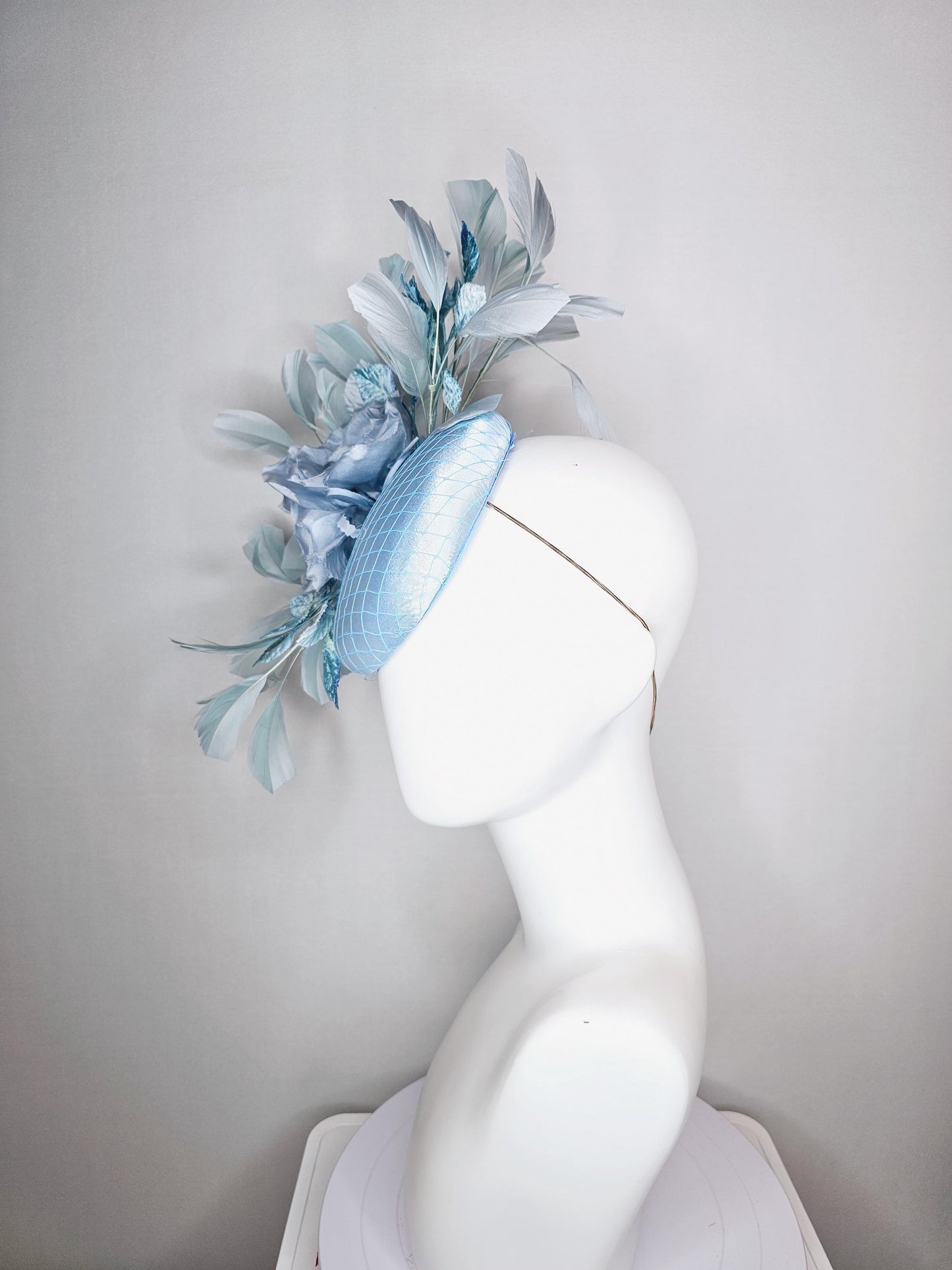 kentucky derby hat fascinator baby blue satin with netting light blue satin rose flowers blue ombre velvet leaves light teal blue feathers