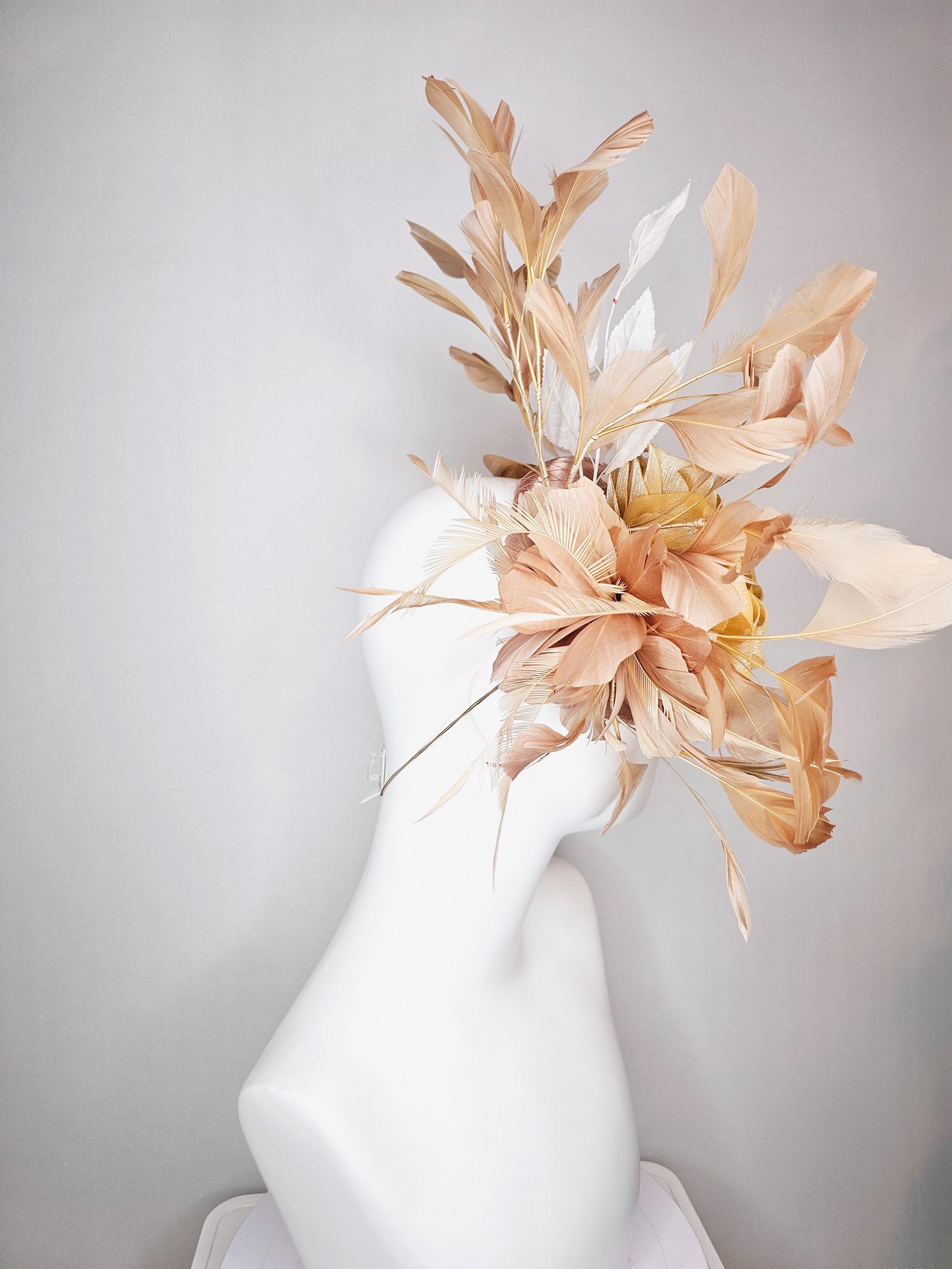 kentucky derby hat fascinator champagne pink satin with netting gold satin rose flower white leaves neutral tan beige branching feathers