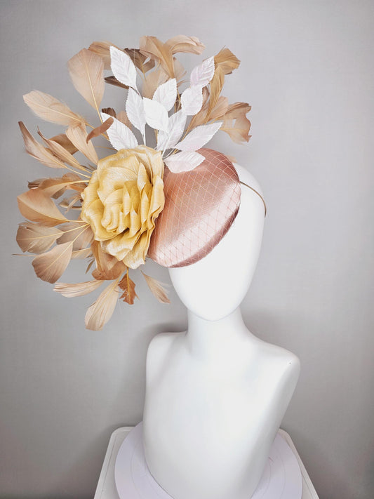 kentucky derby hat fascinator champagne pink satin with netting gold satin rose flower white leaves neutral tan beige branching feathers