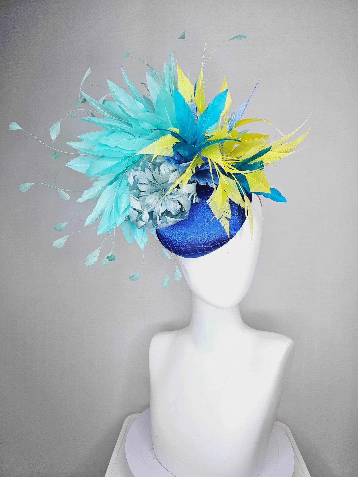 kentucky derby hat fascinator royal blue satin with netting light blue fluffy feather flower turquoise teal and yellow branching feathers