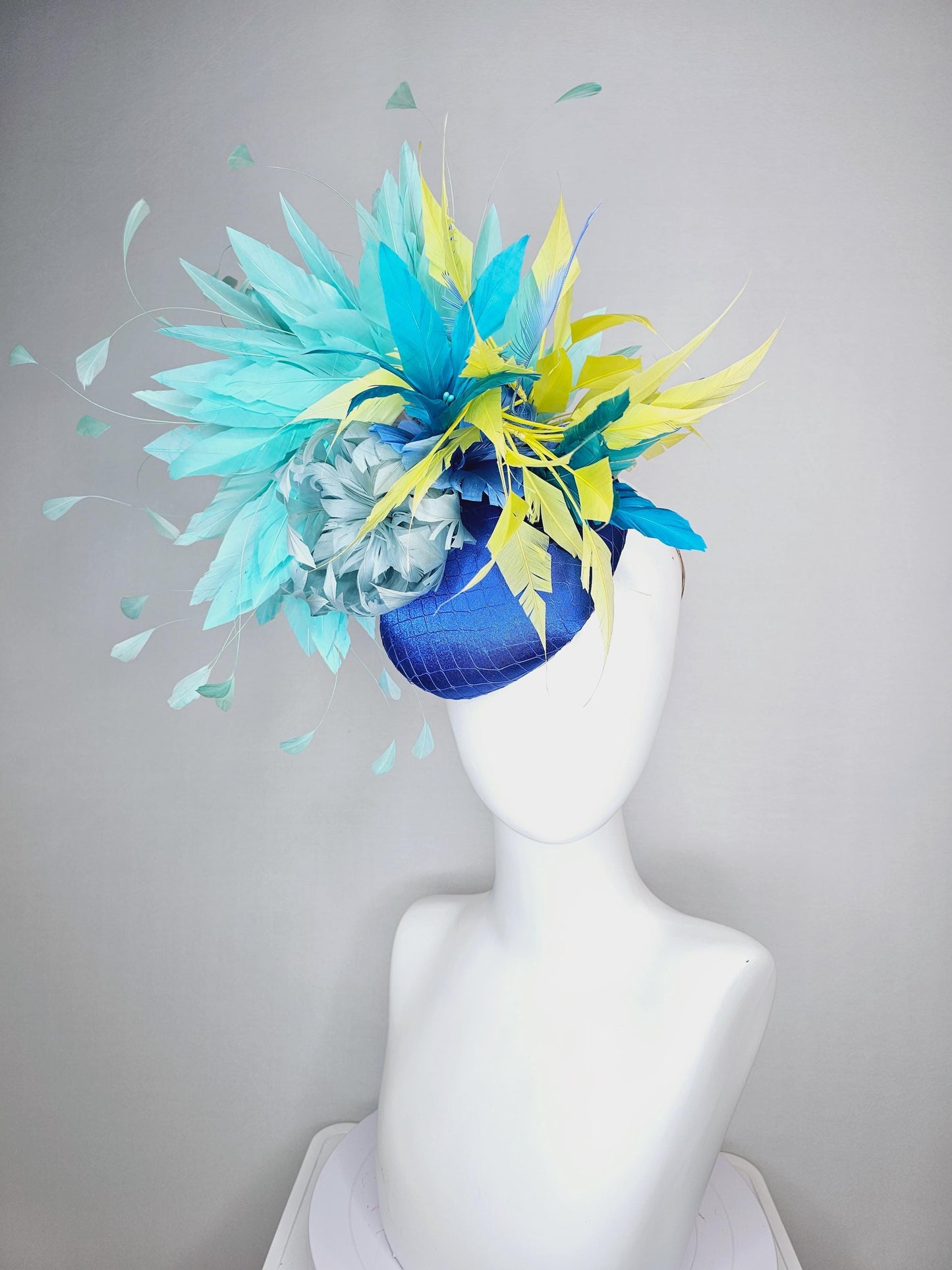 kentucky derby hat fascinator royal blue satin with netting light blue fluffy feather flower turquoise teal and yellow branching feathers