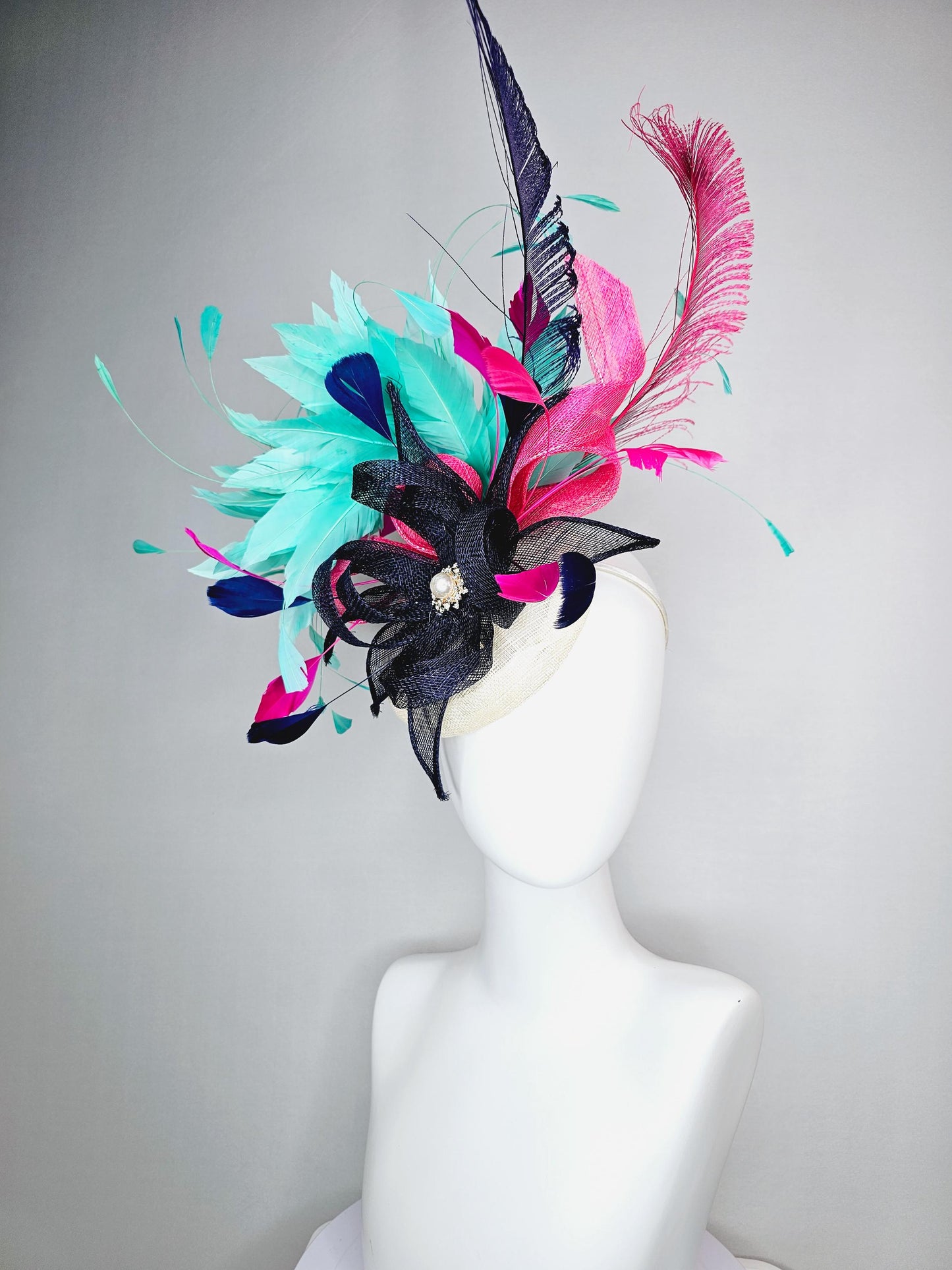 kentucky derby hat fascinator ivory white sinamay with navy blue raspberry pink sinamay flower and aqua green branching feathers