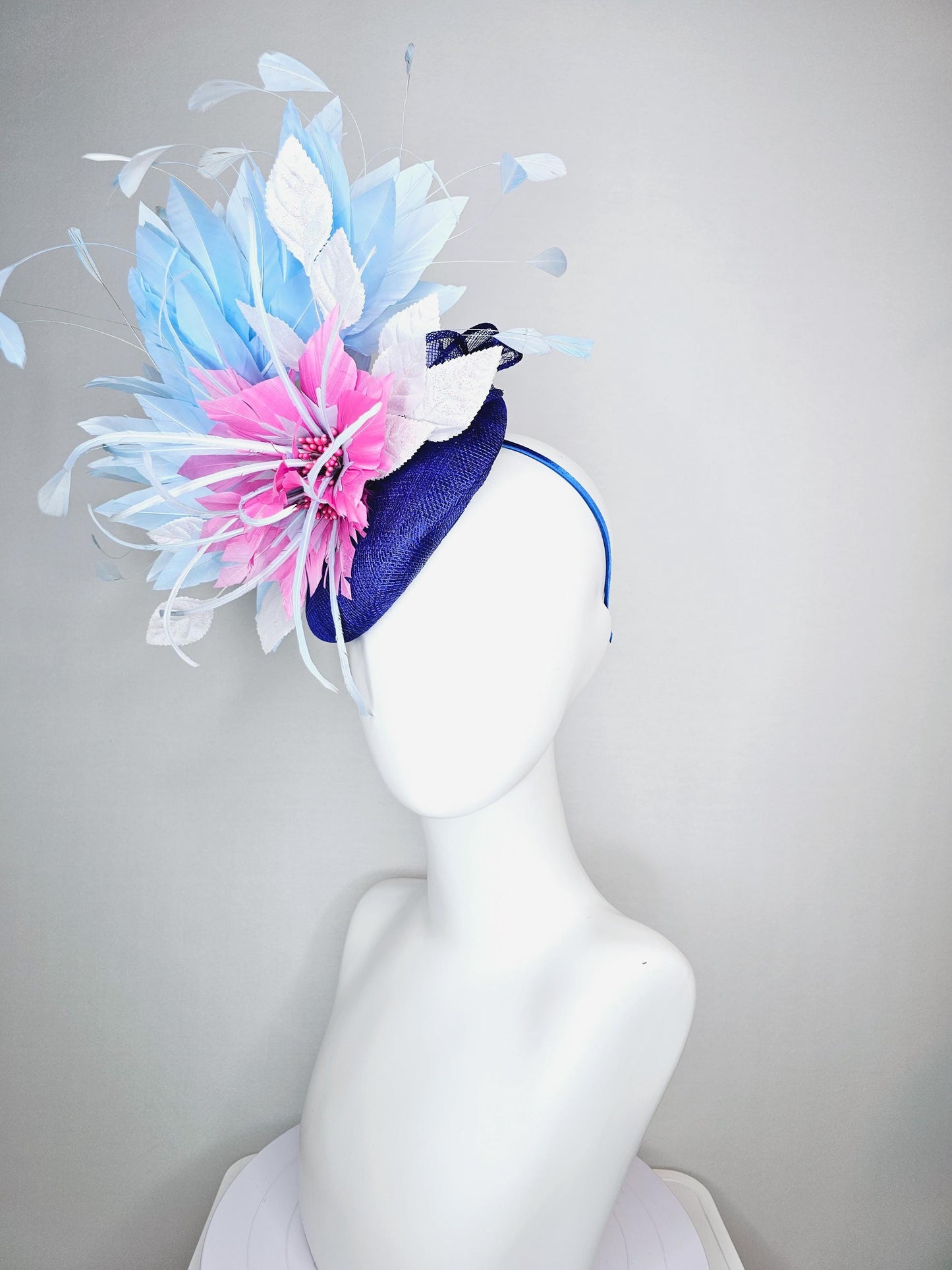 kentucky derby hat fascinator royal blue sinamay with blush pink feather flower and white leaves light baby blue branching feathers