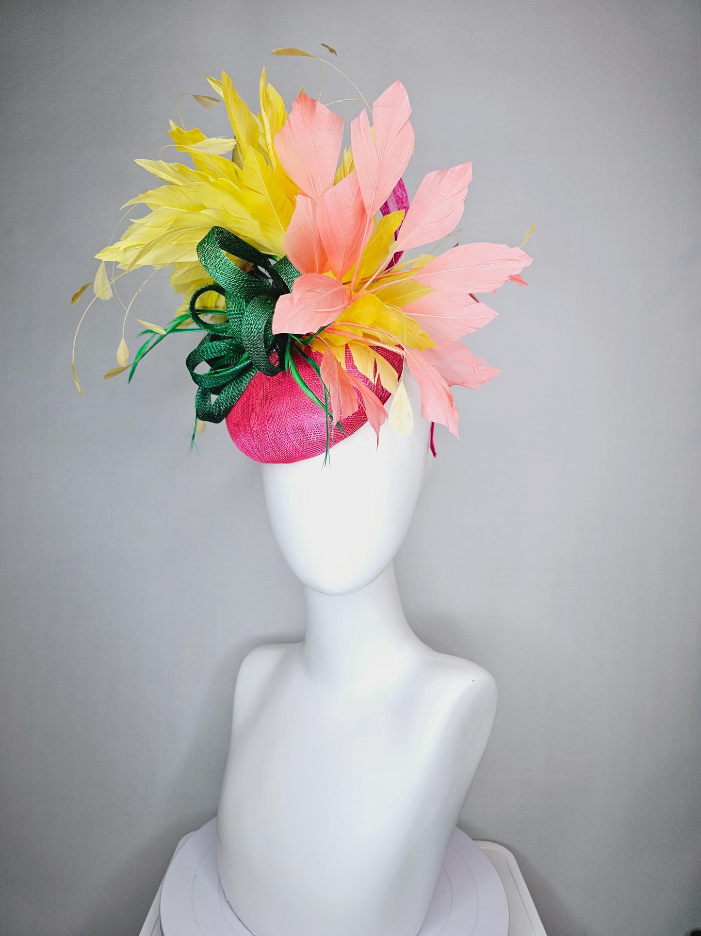 kentucky derby hat fascinator hot pink sinamay with dark green sinamay curls and yellow and peach coral branching feathers