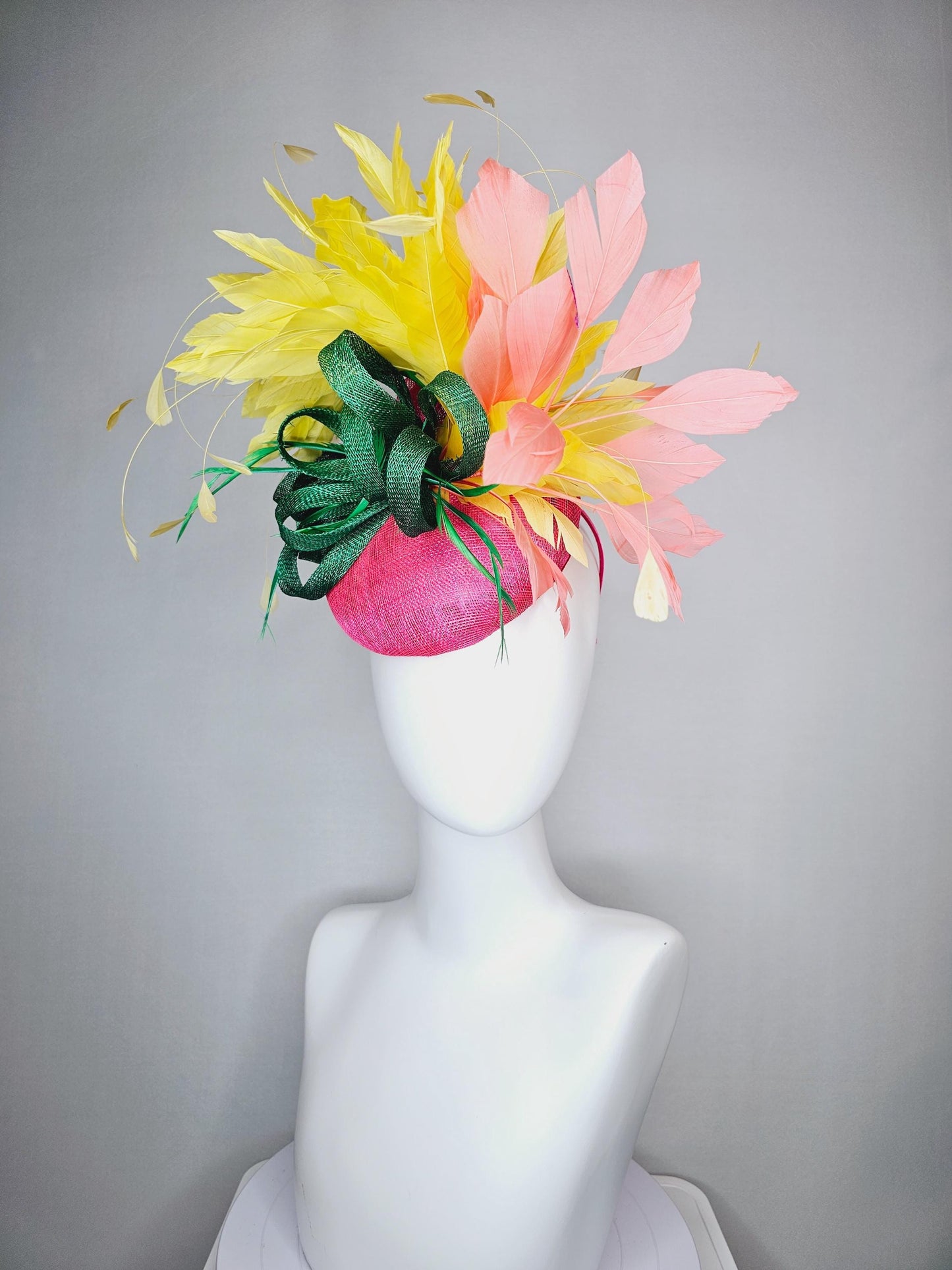 kentucky derby hat fascinator hot pink sinamay with dark green sinamay curls and yellow and peach coral branching feathers