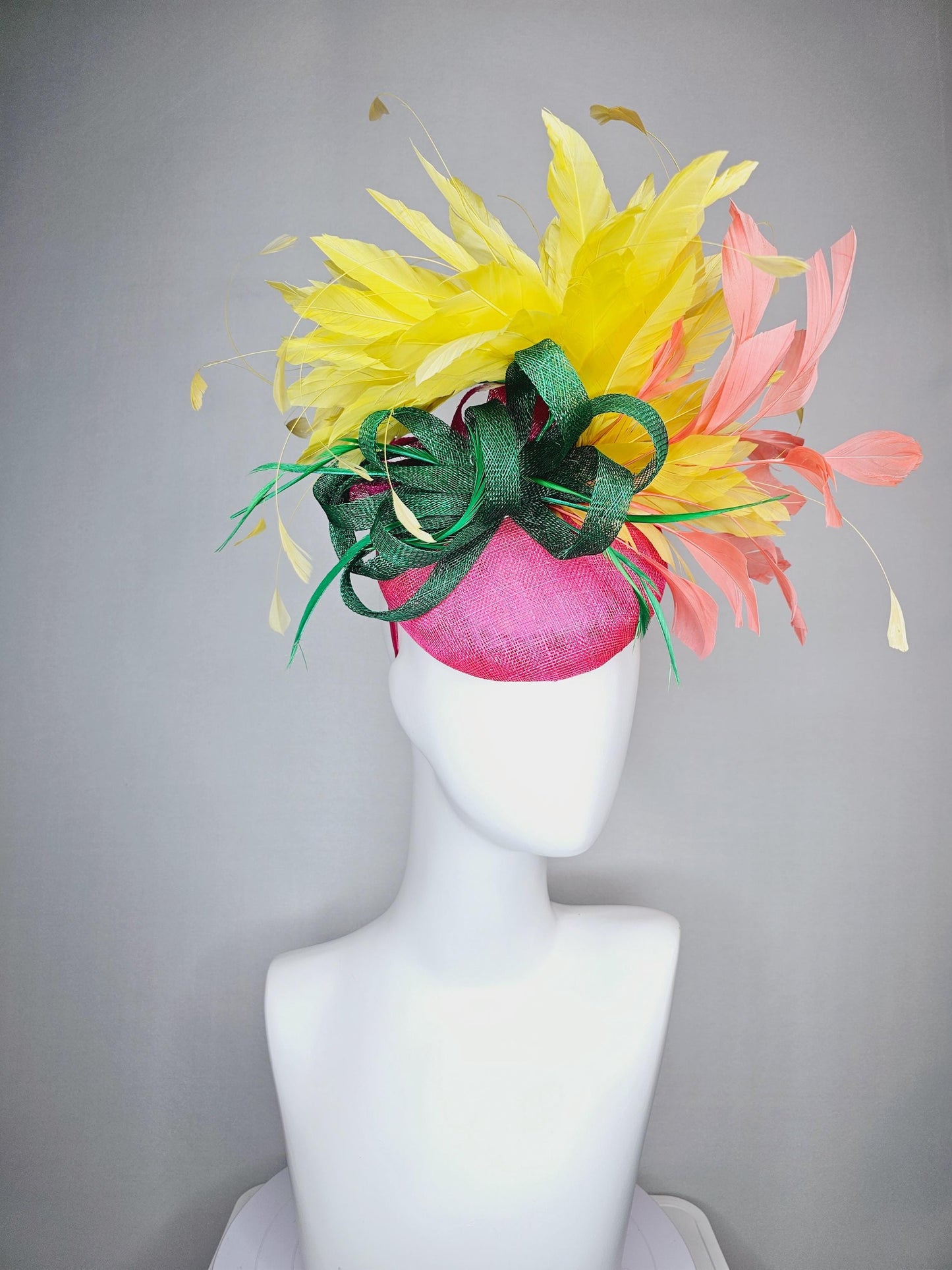 kentucky derby hat fascinator hot pink sinamay with dark green sinamay curls and yellow and peach coral branching feathers