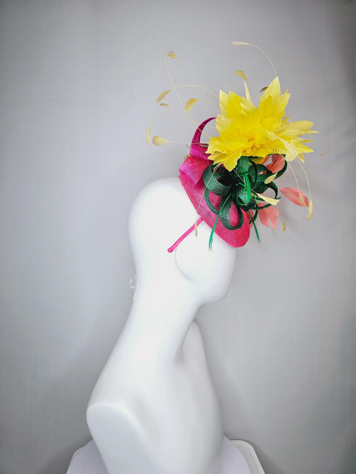kentucky derby hat fascinator hot pink sinamay with dark green sinamay curls and yellow and peach coral branching feathers