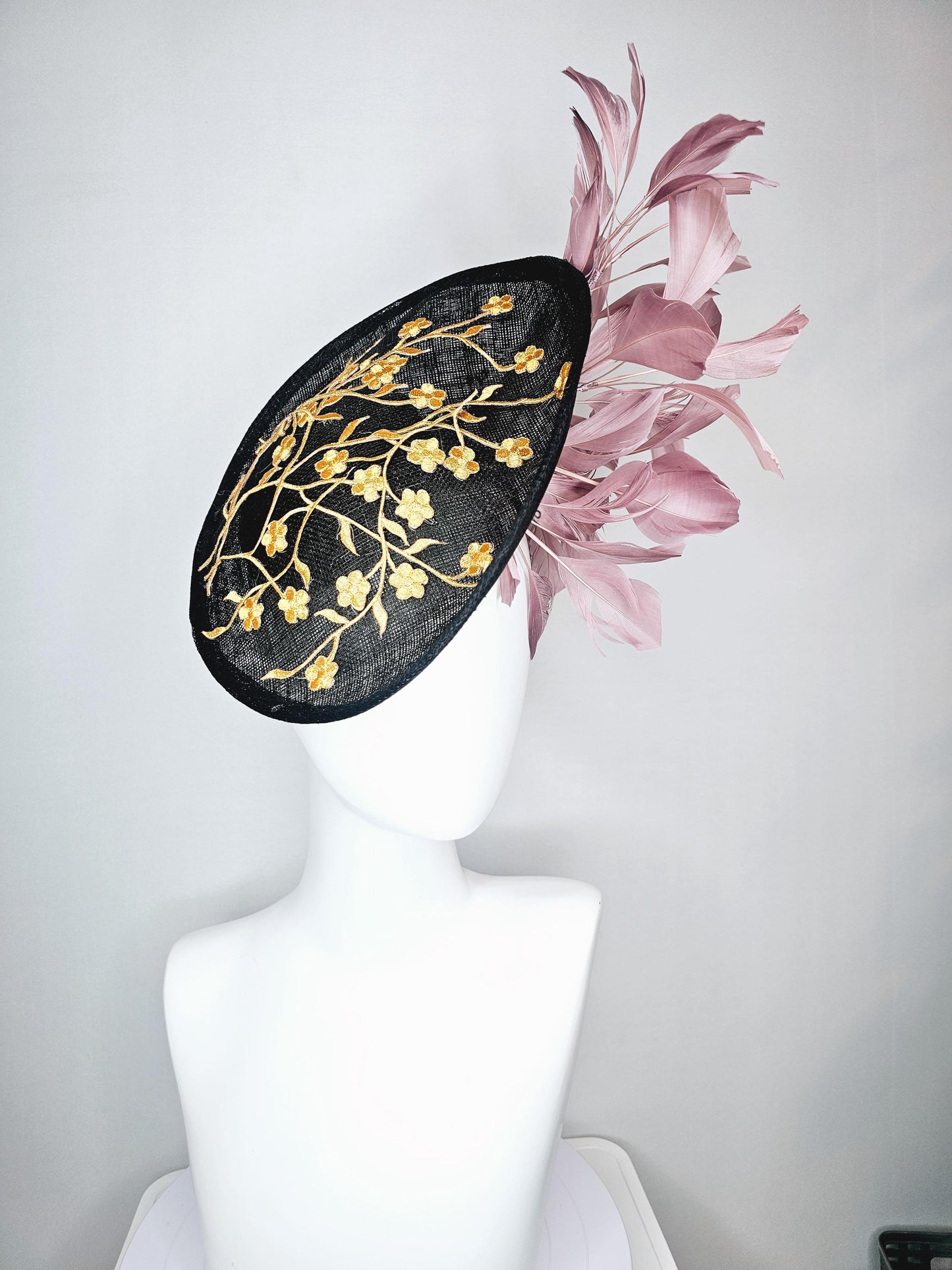 kentucky derby hat fascinator black sinamay saucer with embroidered yellow gold flowers and dusty rose pink branching feathers