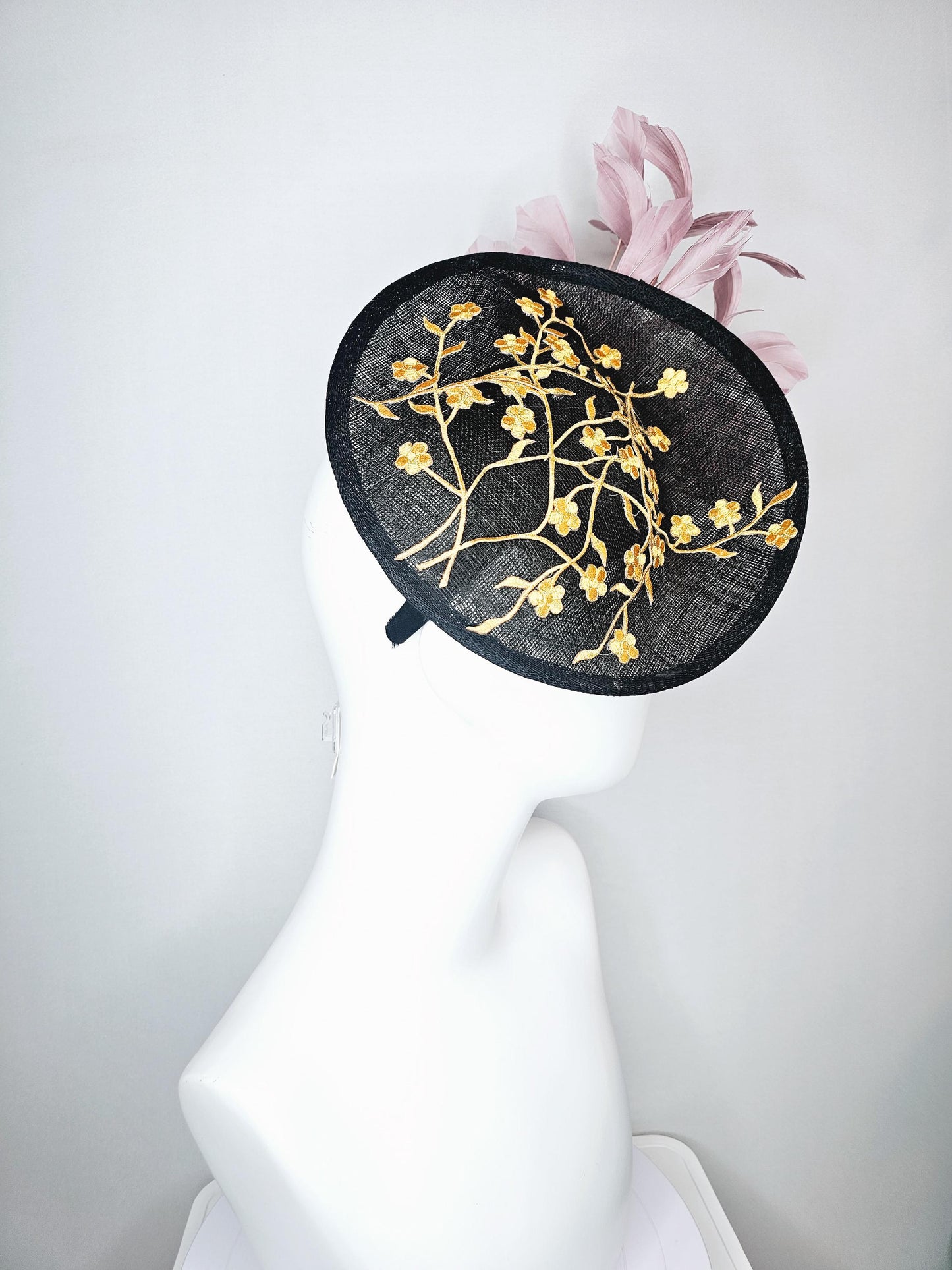 kentucky derby hat fascinator black sinamay saucer with embroidered yellow gold flowers and dusty rose pink branching feathers