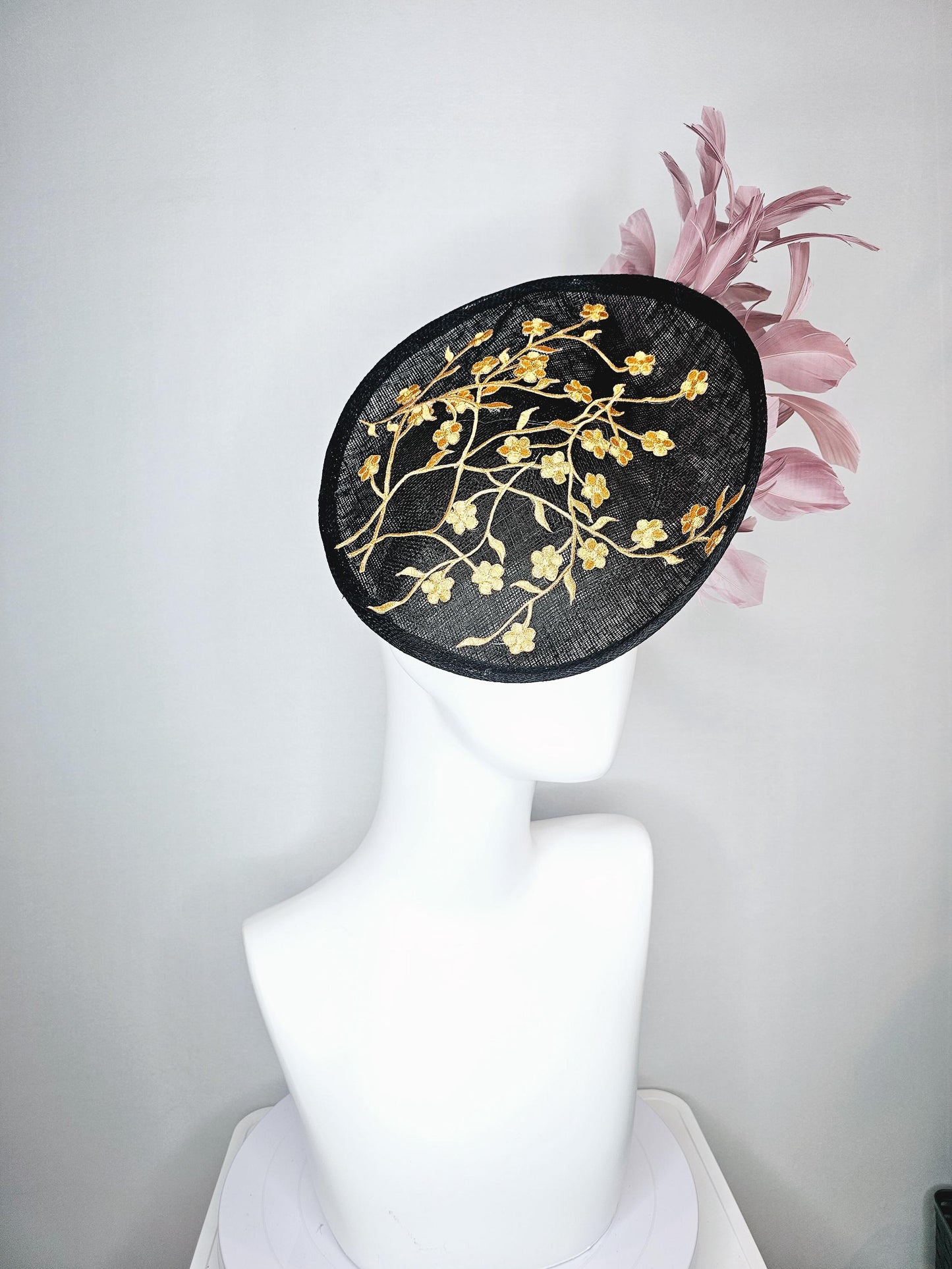 kentucky derby hat fascinator black sinamay saucer with embroidered yellow gold flowers and dusty rose pink branching feathers