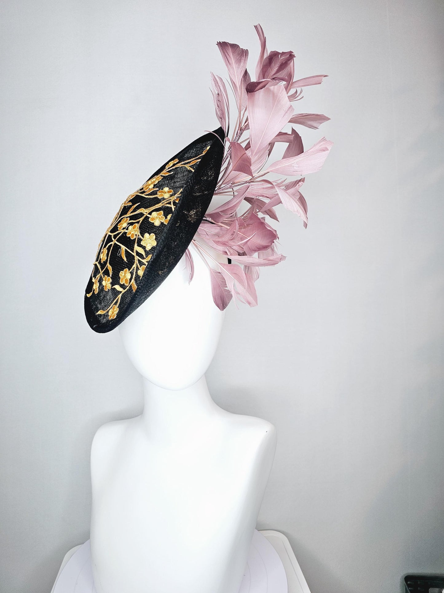 kentucky derby hat fascinator black sinamay saucer with embroidered yellow gold flowers and dusty rose pink branching feathers