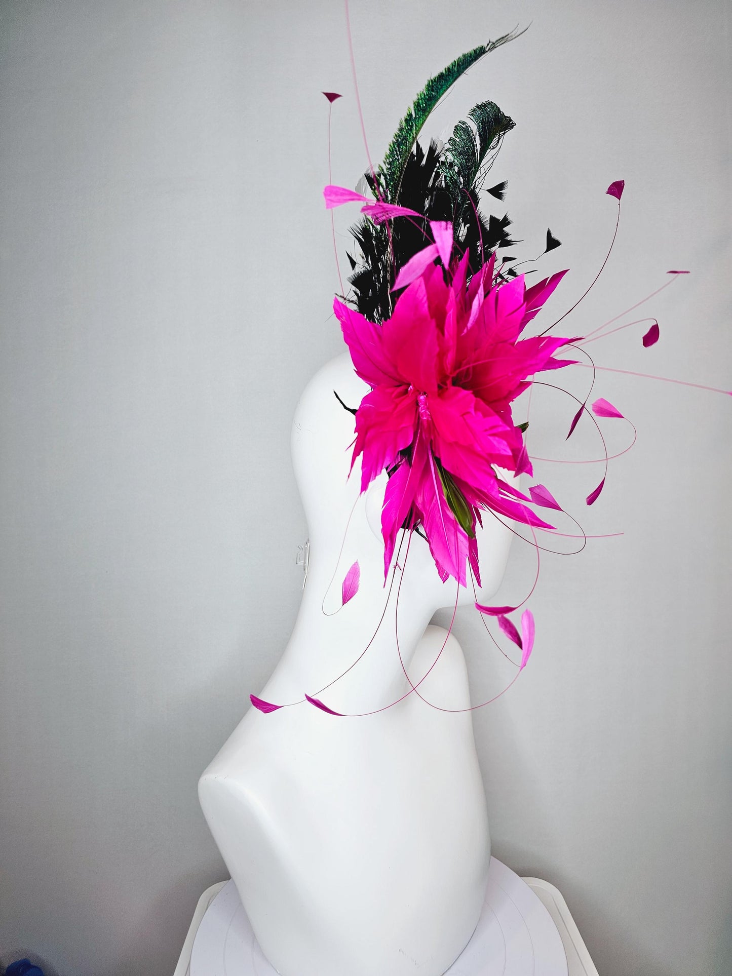 kentucky derby hat fascinator black satin headband with fuchsia pink feather flower green feathers and black and white branching feathers