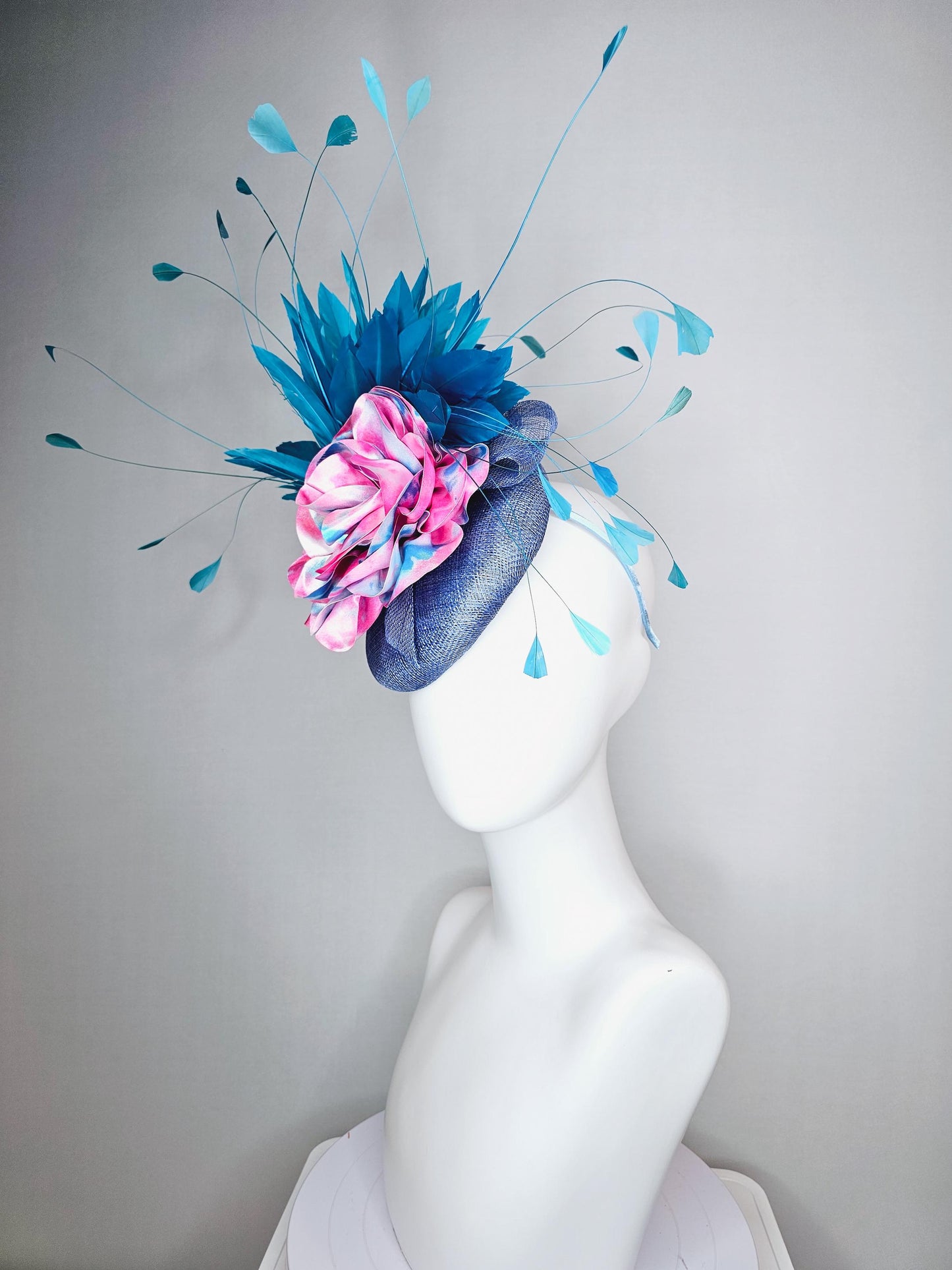 kentucky derby hat fascinator royal blue sinamay base with tie dye pink blue silk large flower and teal blue branching feathers