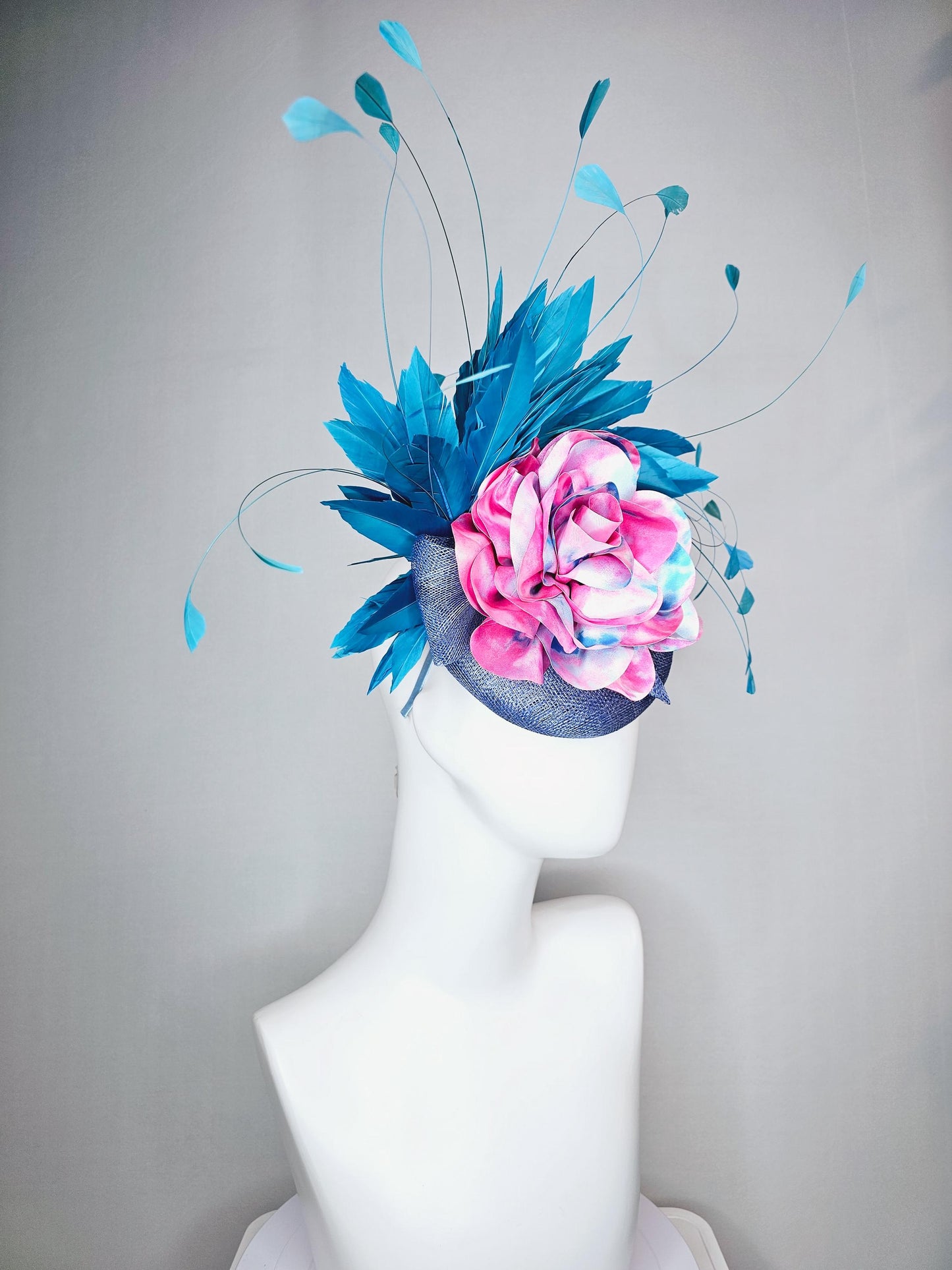 kentucky derby hat fascinator royal blue sinamay base with tie dye pink blue silk large flower and teal blue branching feathers