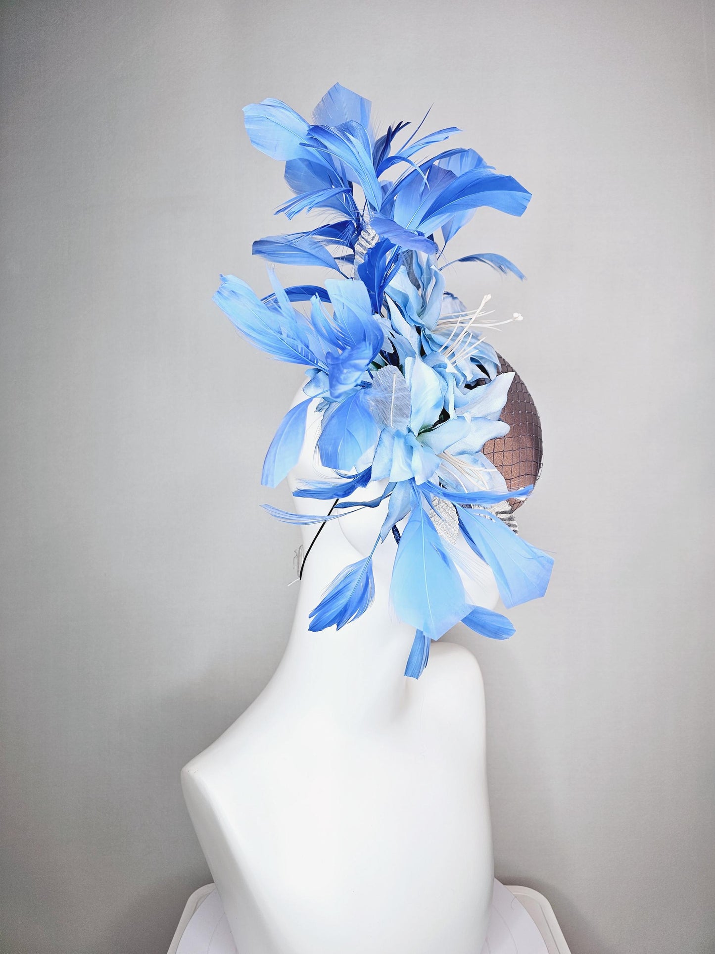 kentucky derby hat fascinator silver gray satin with netting light baby blue satin flowers silver leaves and royal blue branching feathers