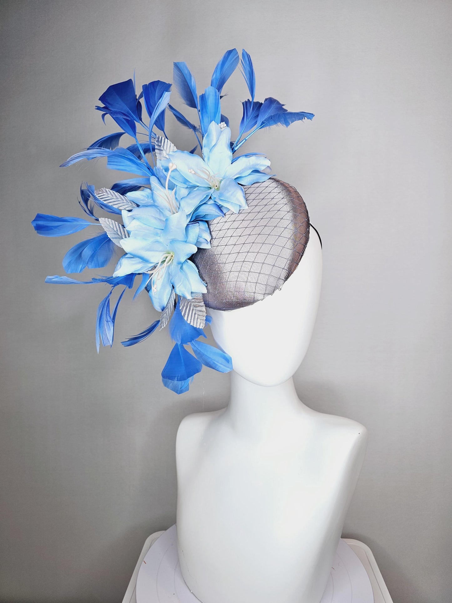 kentucky derby hat fascinator silver gray satin with netting light baby blue satin flowers silver leaves and royal blue branching feathers