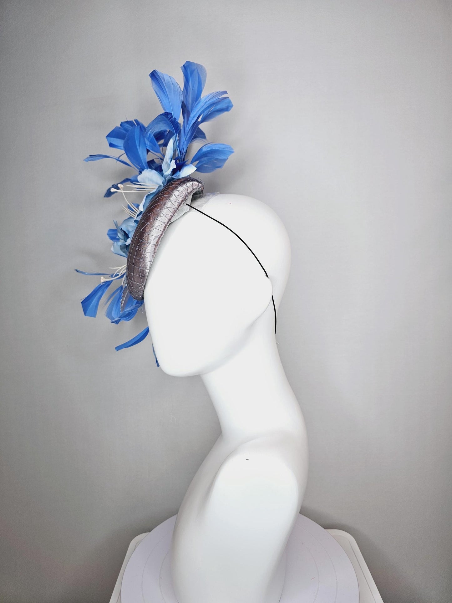 kentucky derby hat fascinator silver gray satin with netting light baby blue satin flowers silver leaves and royal blue branching feathers