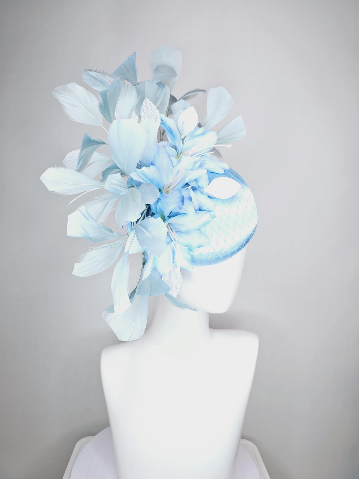 kentucky derby hat fascinator baby blue satin with netting light blue ombre satin flowers and leaves and light baby blue branching feathers