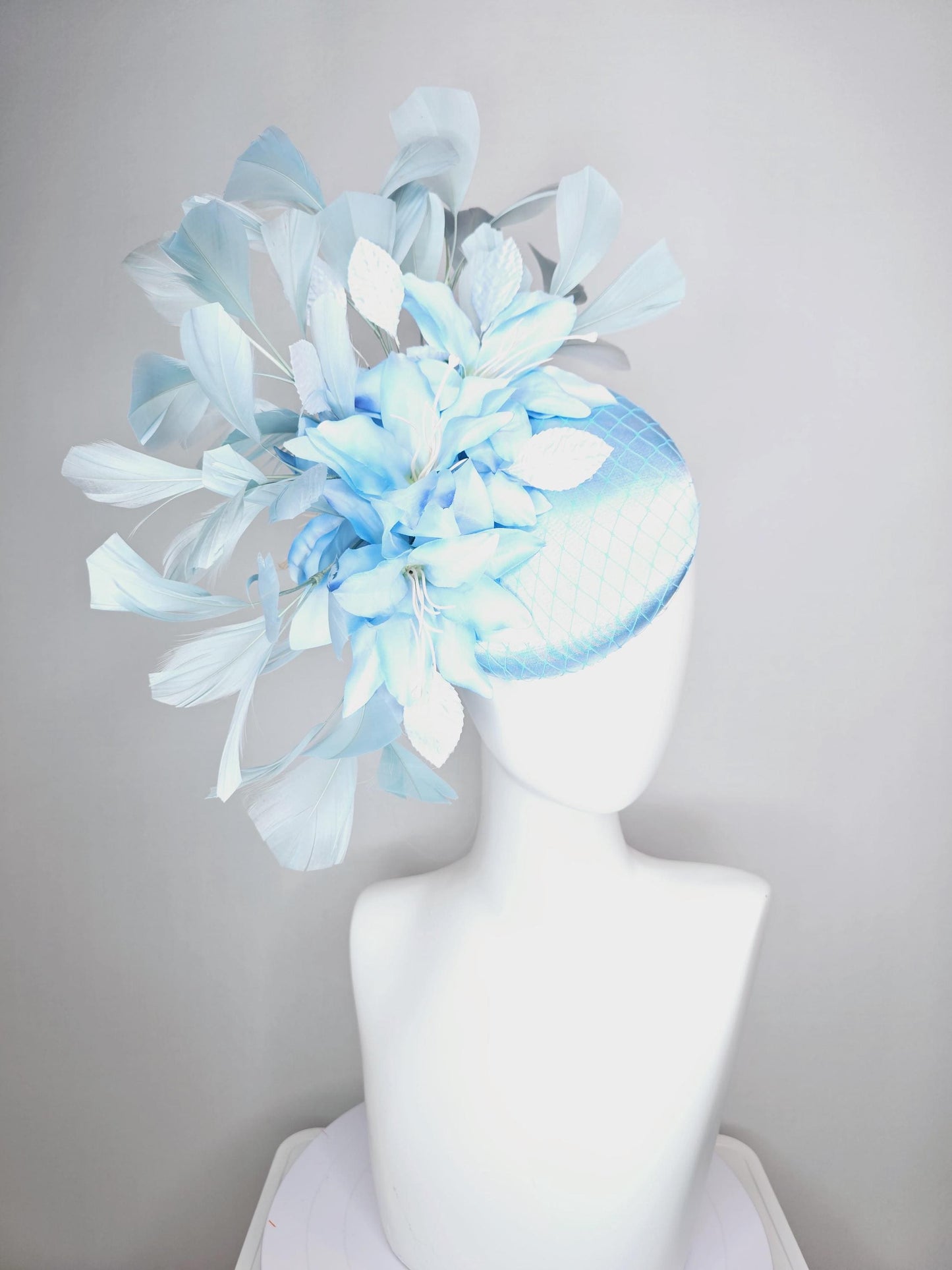 kentucky derby hat fascinator baby blue satin with netting light blue ombre satin flowers and leaves and light baby blue branching feathers